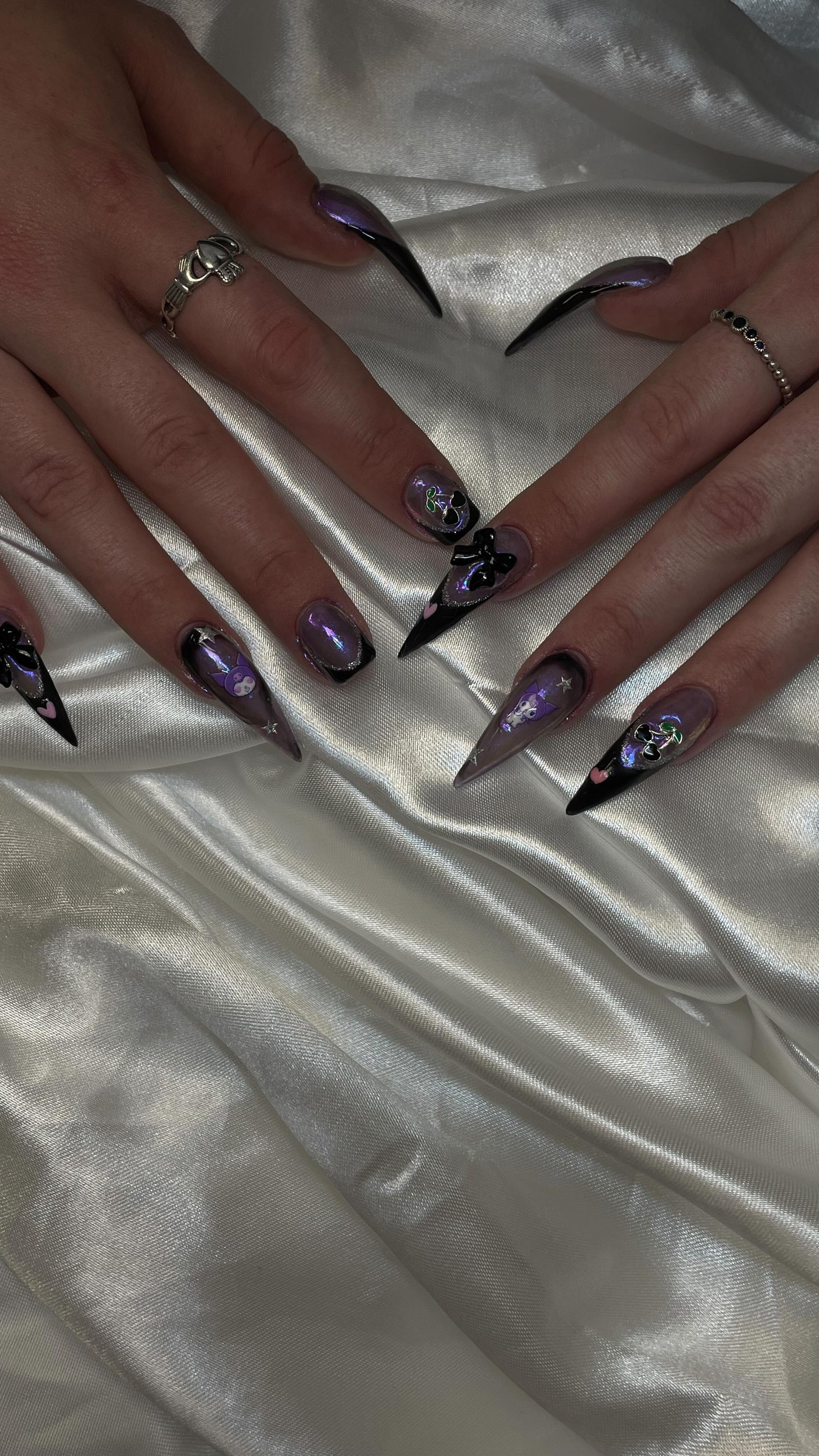 Elegant Stiletto Nails with Artistic Designs