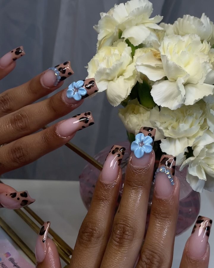 Artistic Nude Nails with Floral Accents
