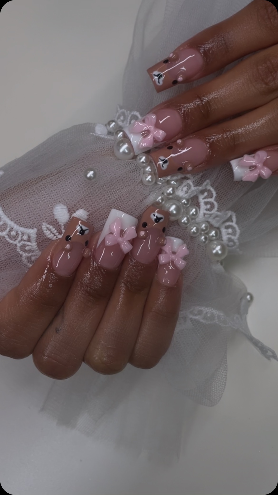 Elegant Pink and Nude Nails with Bows