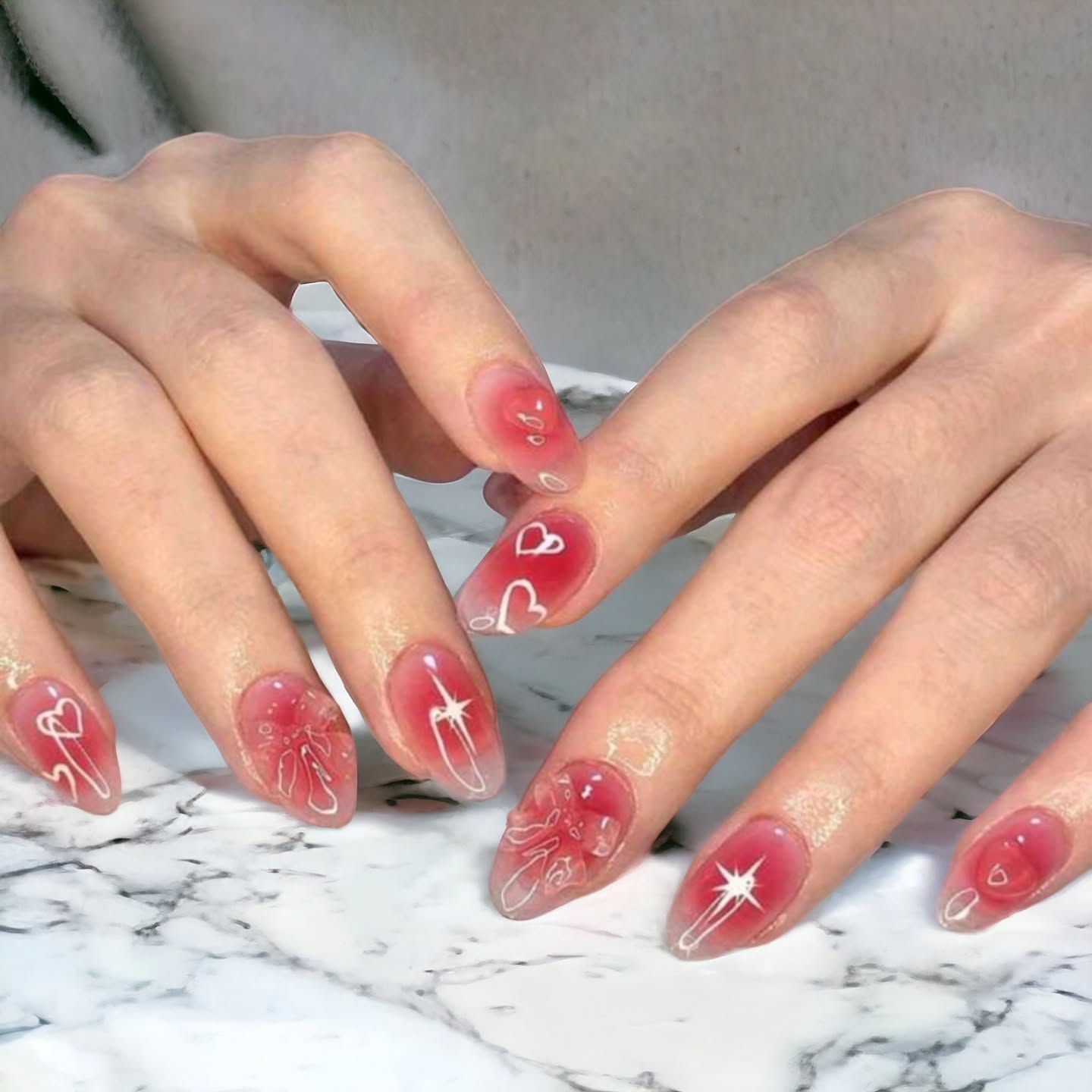 Artistic Red Nails with Hearts