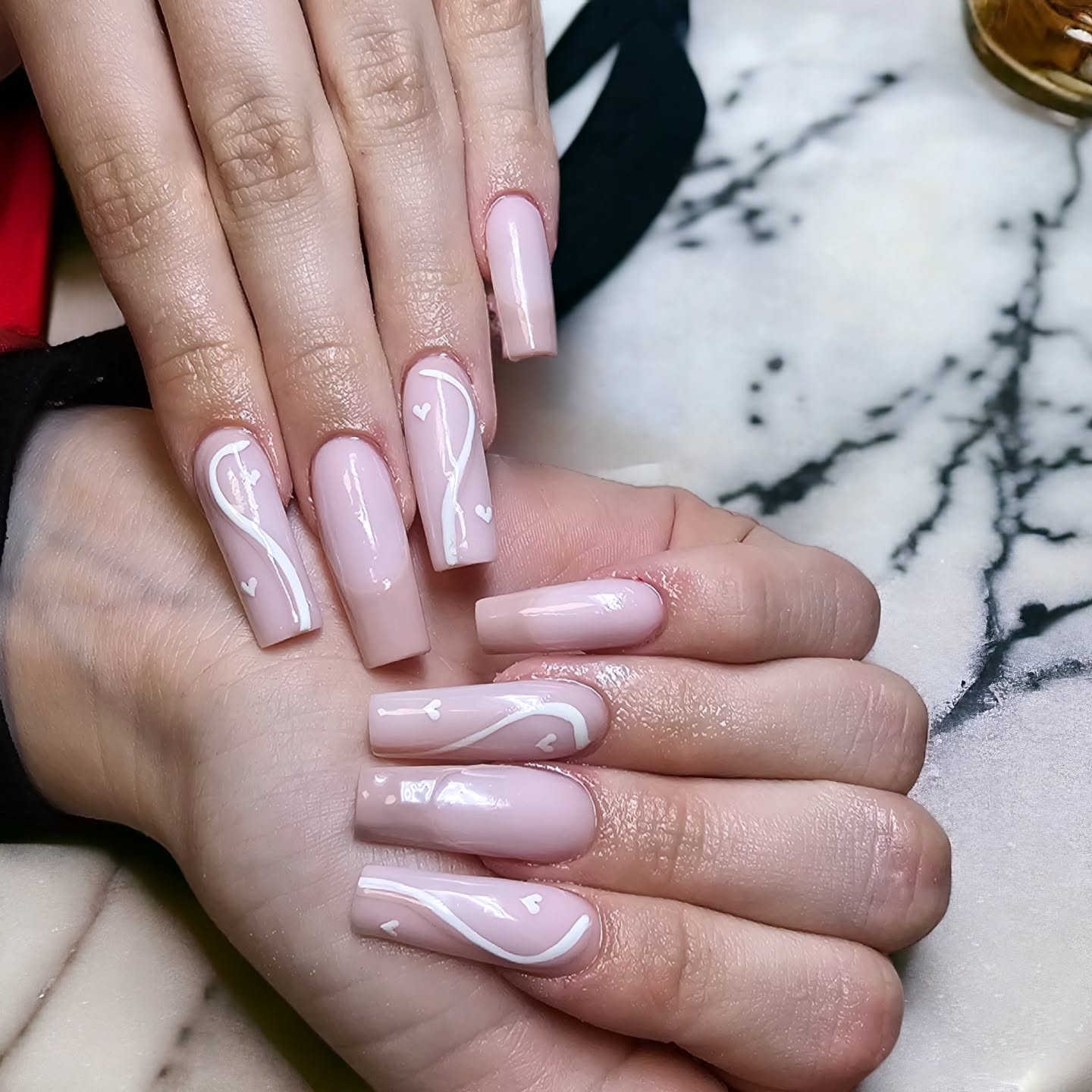 Elegant Nude Nail Art with Hearts