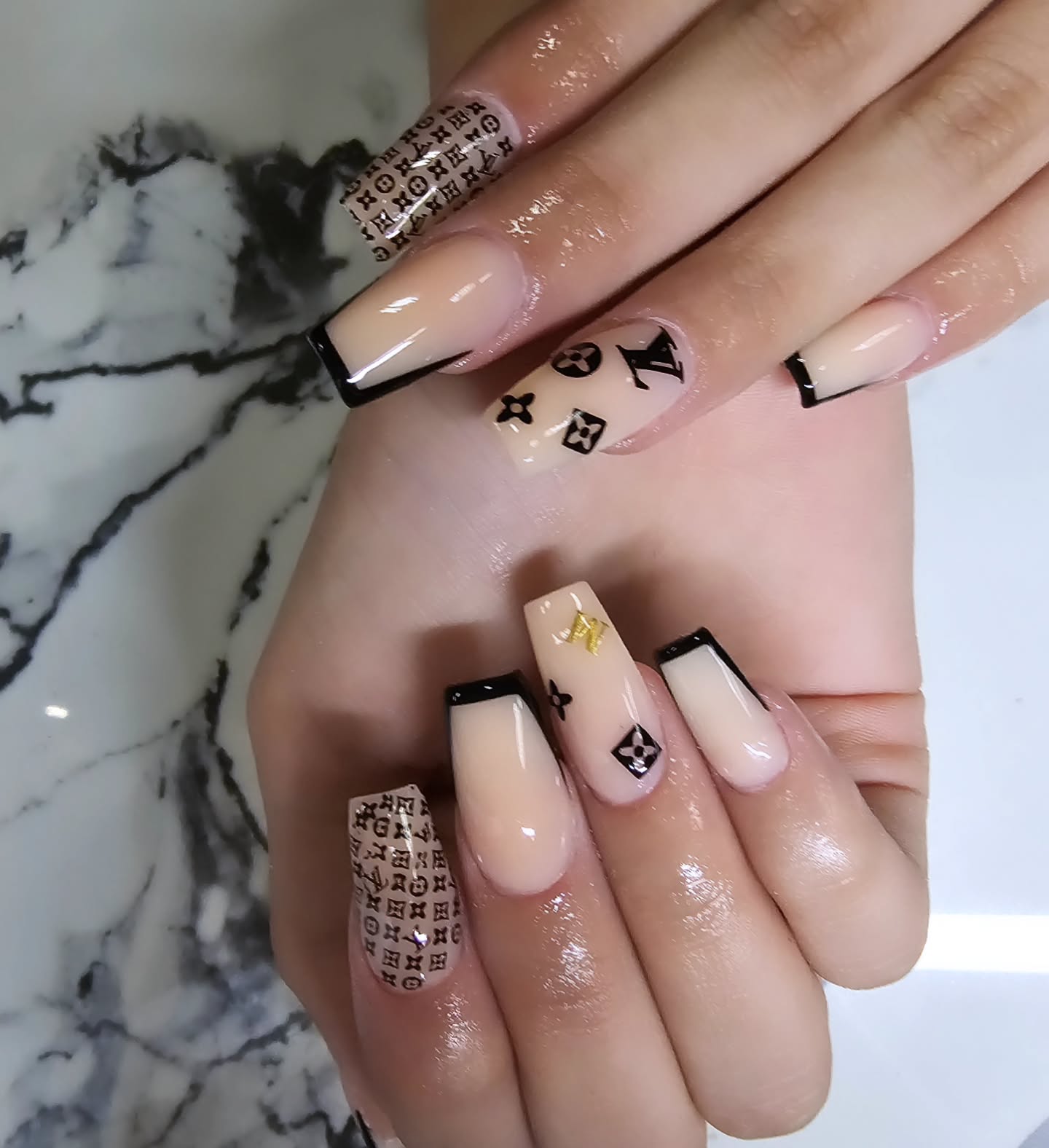 Elegant Nude and Black Nail Design