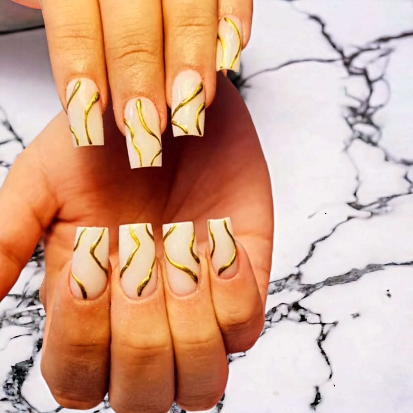 Elegant Nude and Gold Nail Art