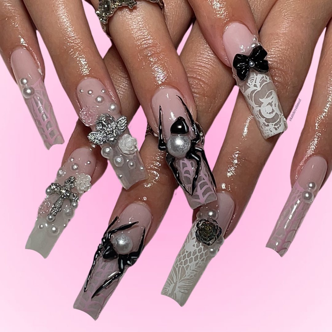 Elegant Artistic Nude Nails with Black and White Accents