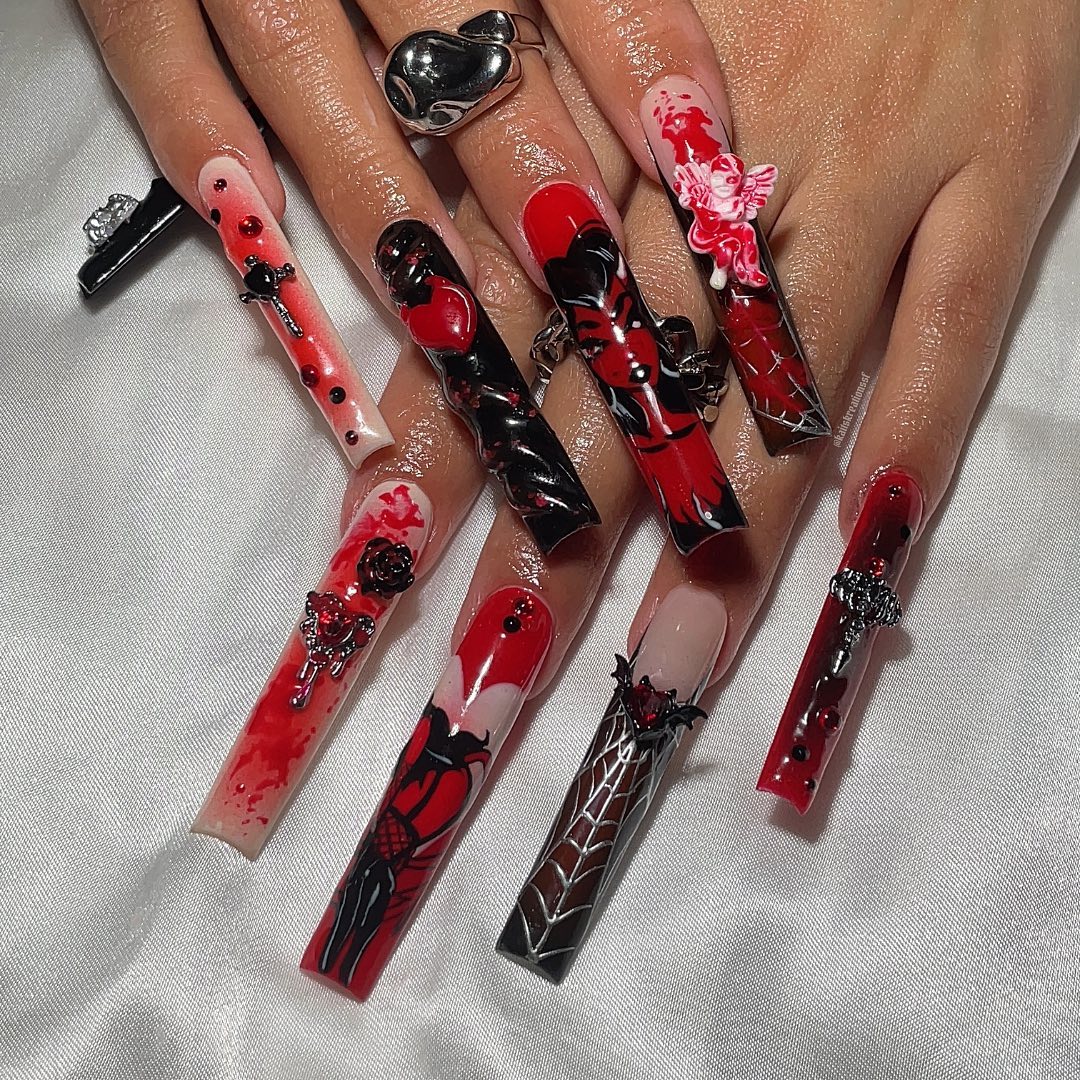 Artistic Red and Black Nail Design