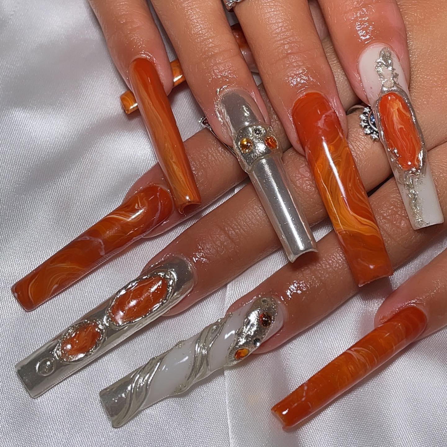 Artistic Orange and Silver Nails