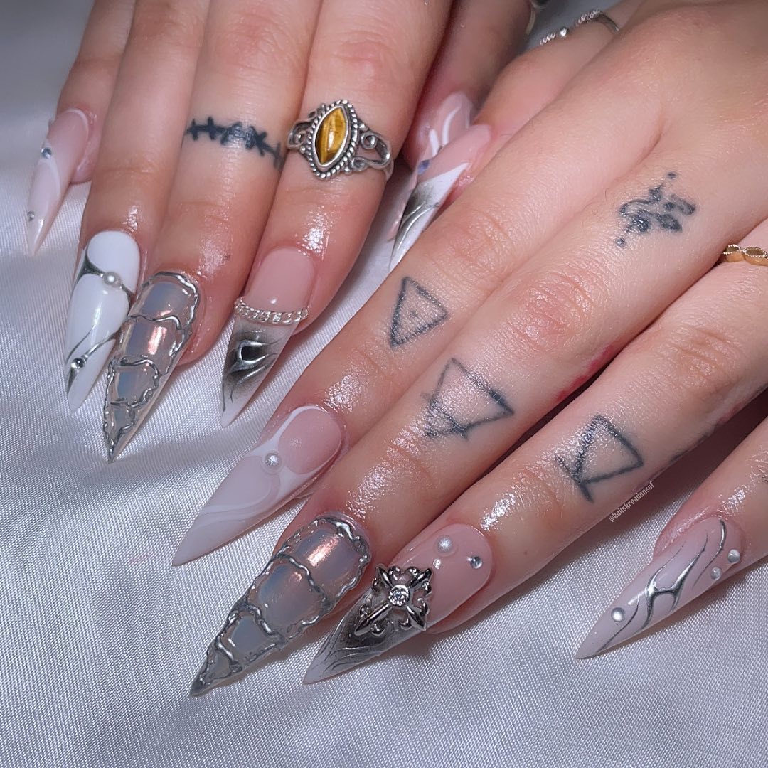 Artistic Stiletto Nails with Silver Accents