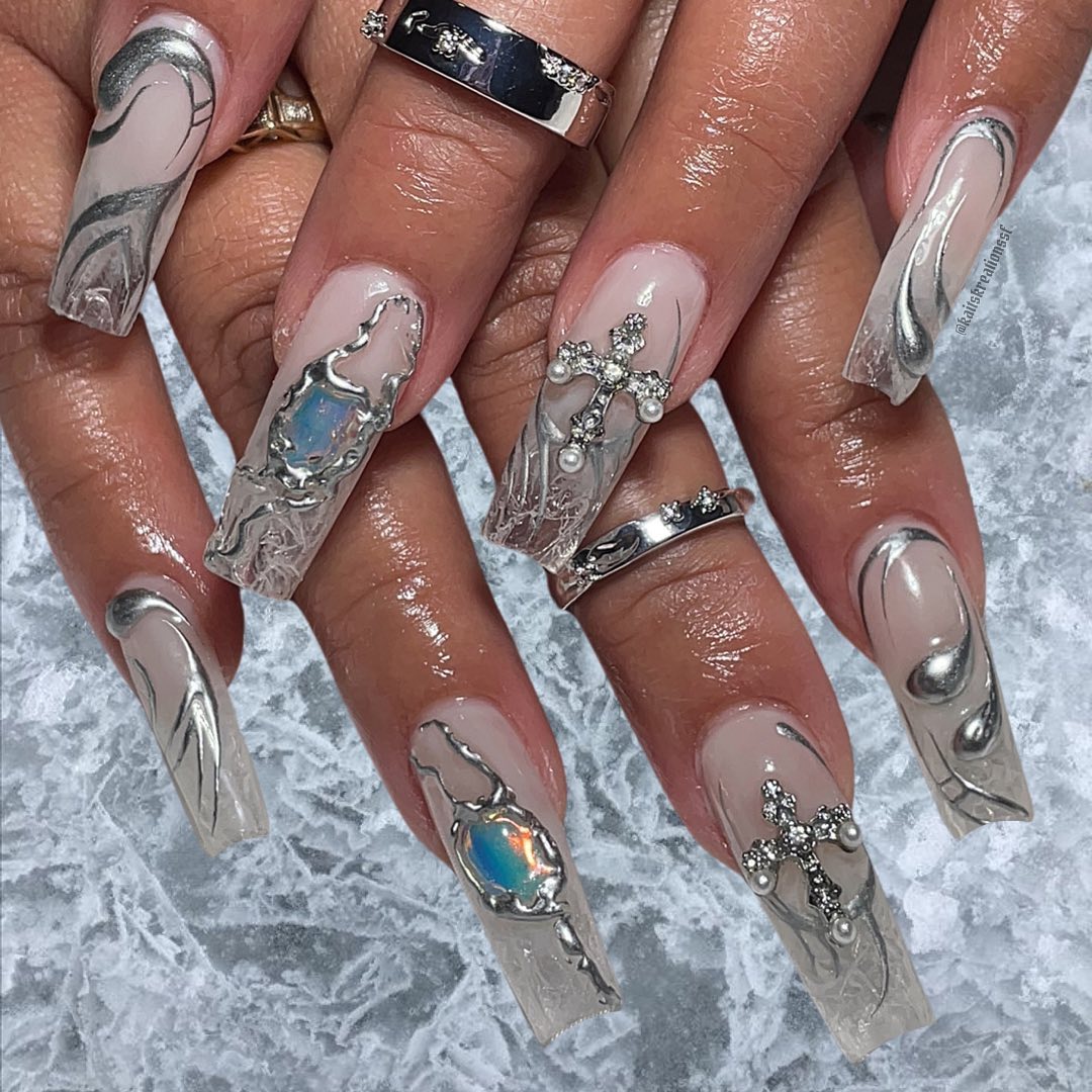 Artistic Nude Nails with Silver Accents