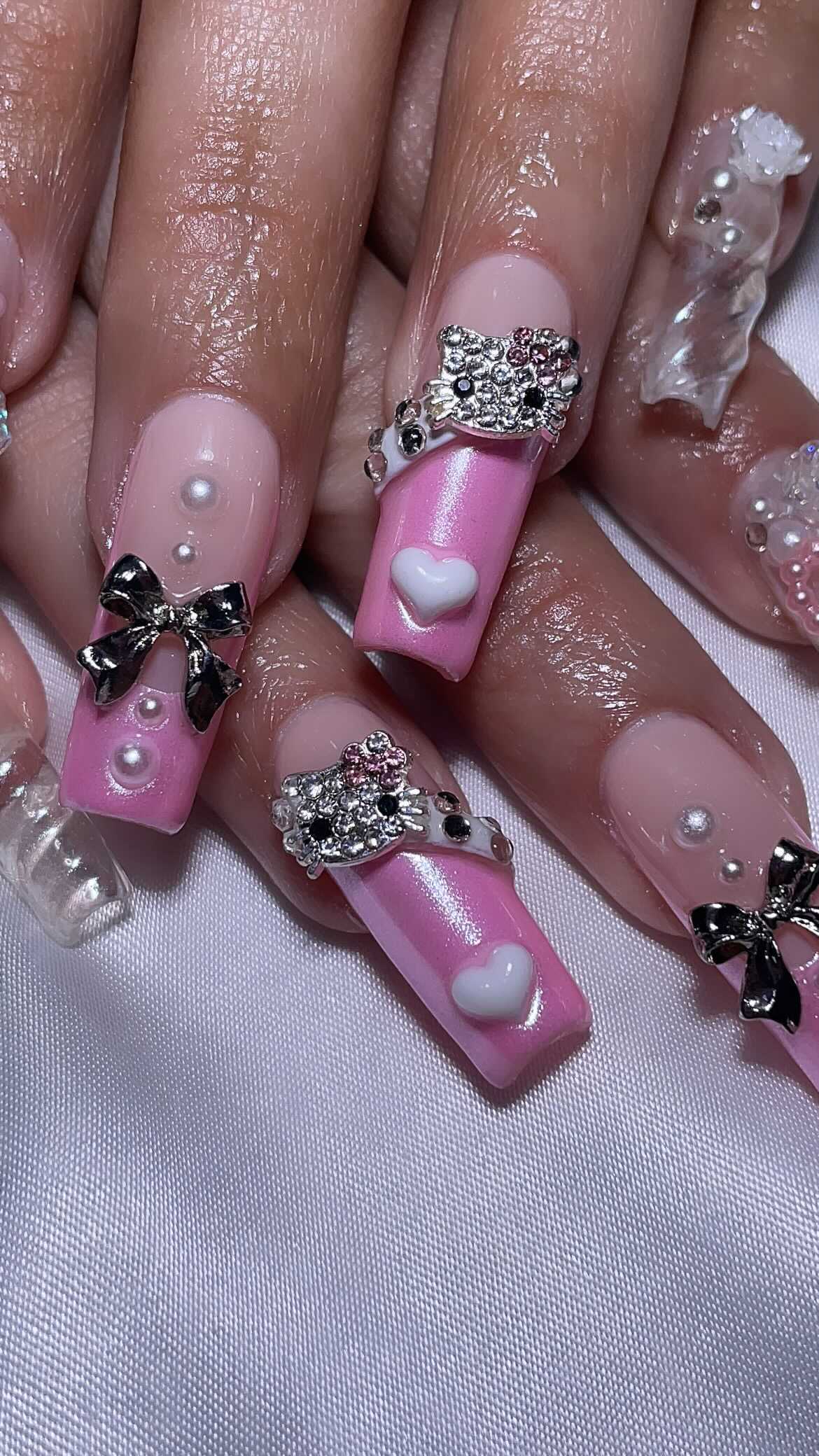 Cute Pink Themed Nails with Bows and Gems
