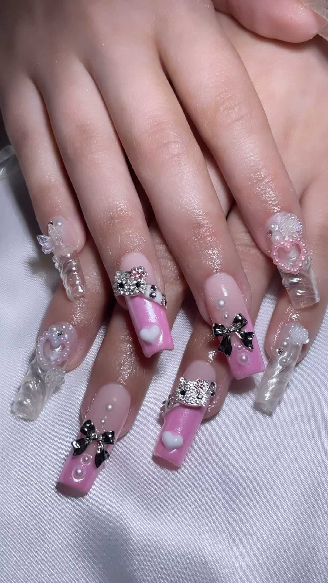 Fashionable Pink Nail Art with Bows and Gems