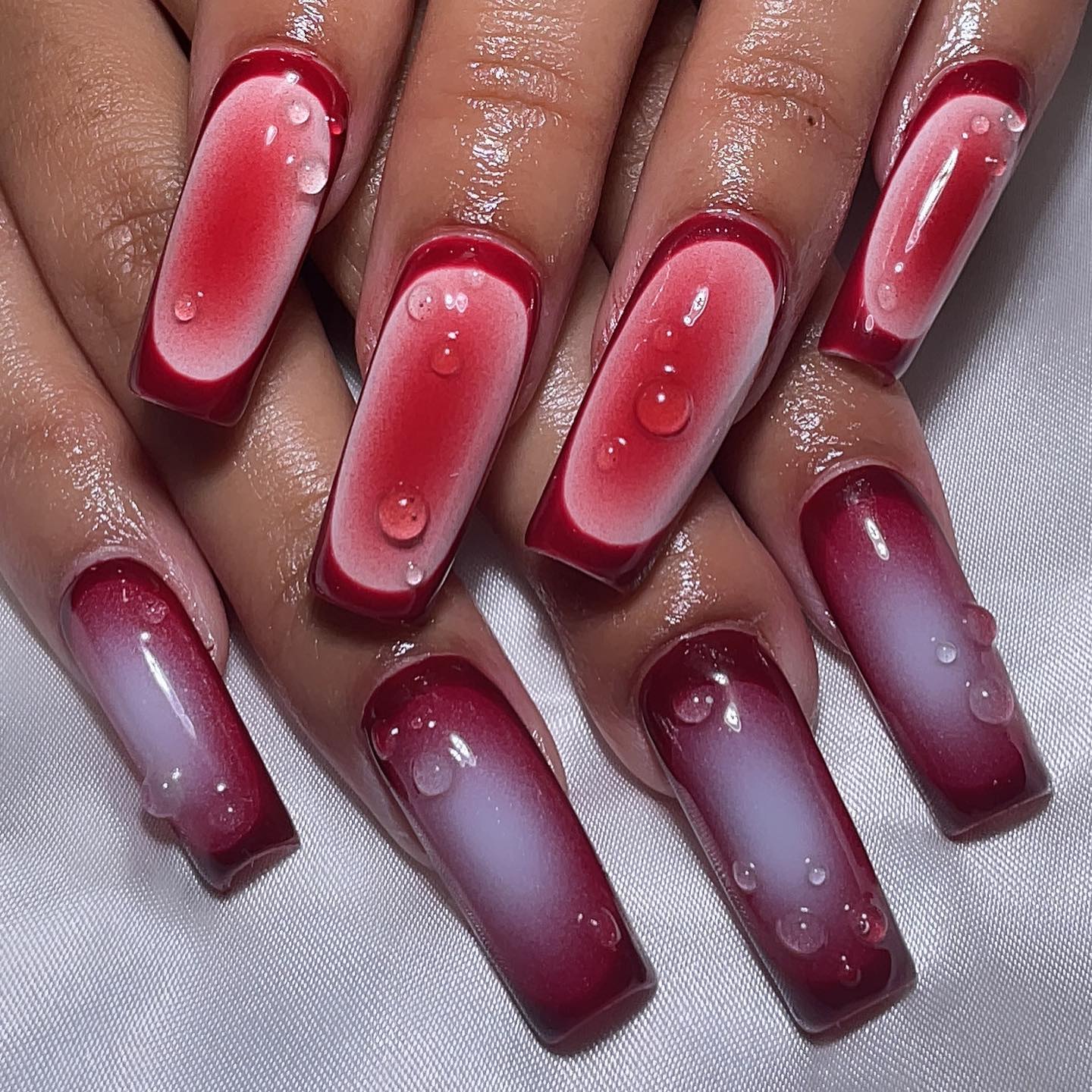 Elegant Red Ombre Nails with Droplets