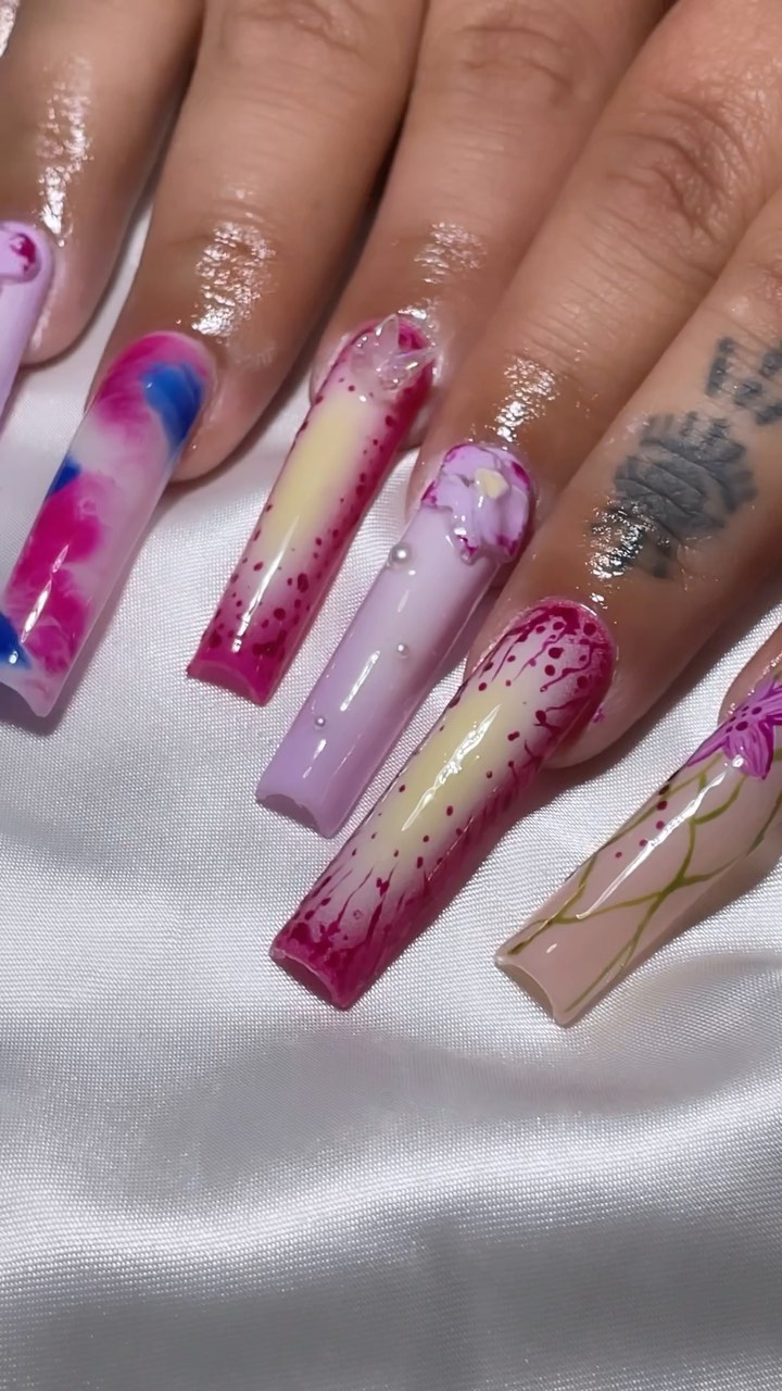 Artistic Pink Nails with Floral Patterns