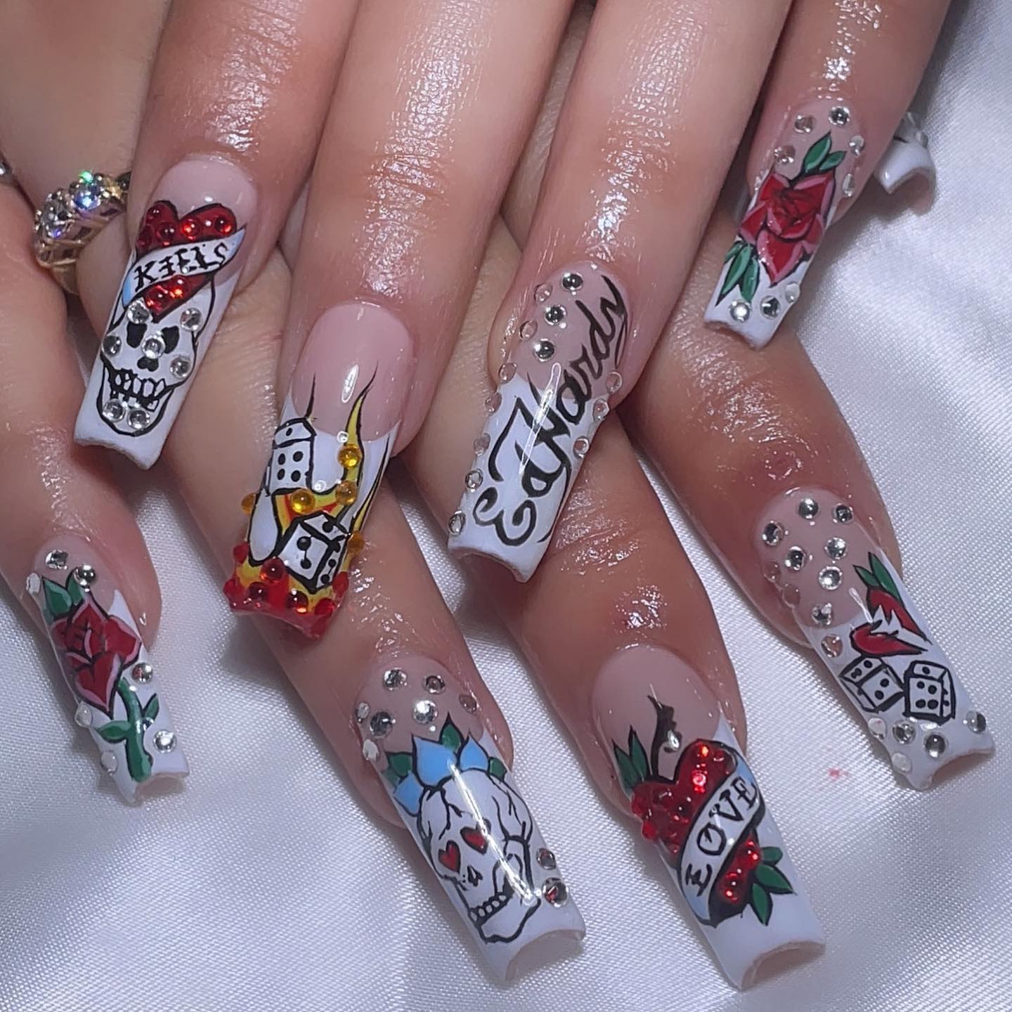 Artistic Nail Design with Roses and Skulls