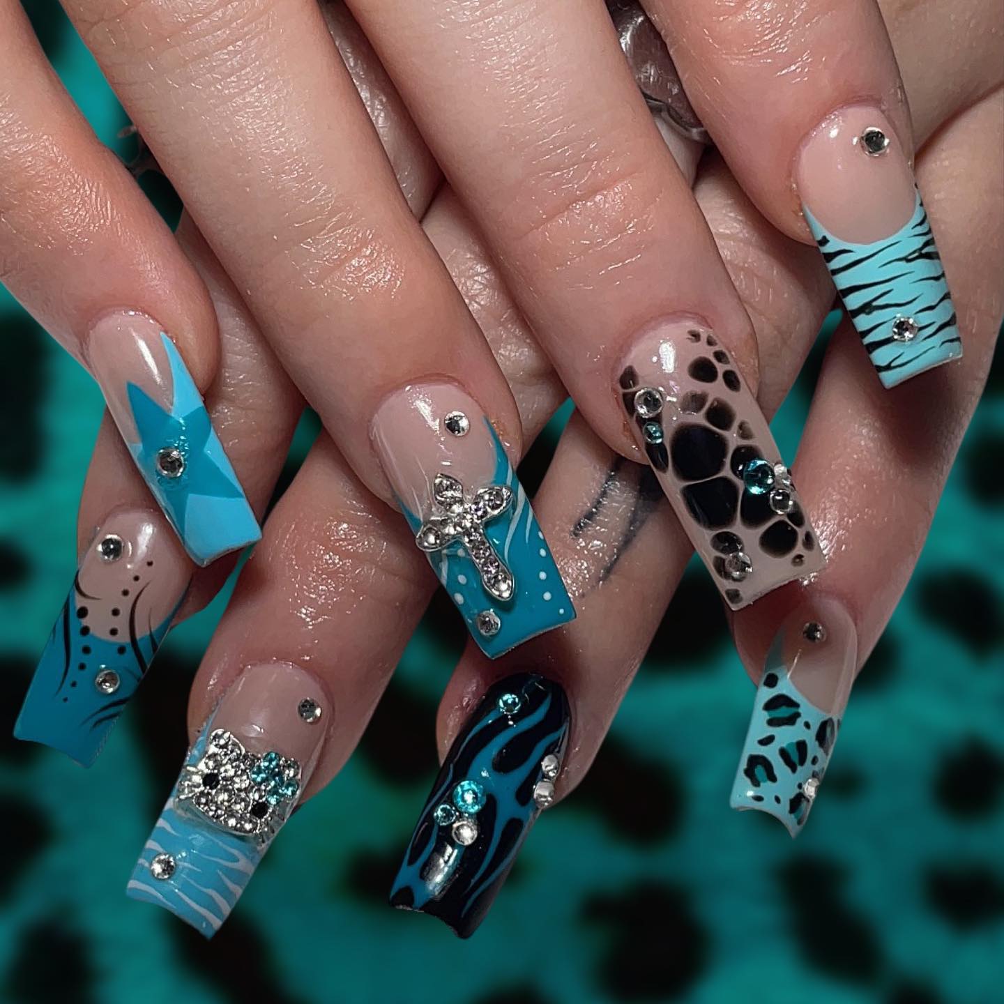 Artistic Blue and Nude Nails with Gems