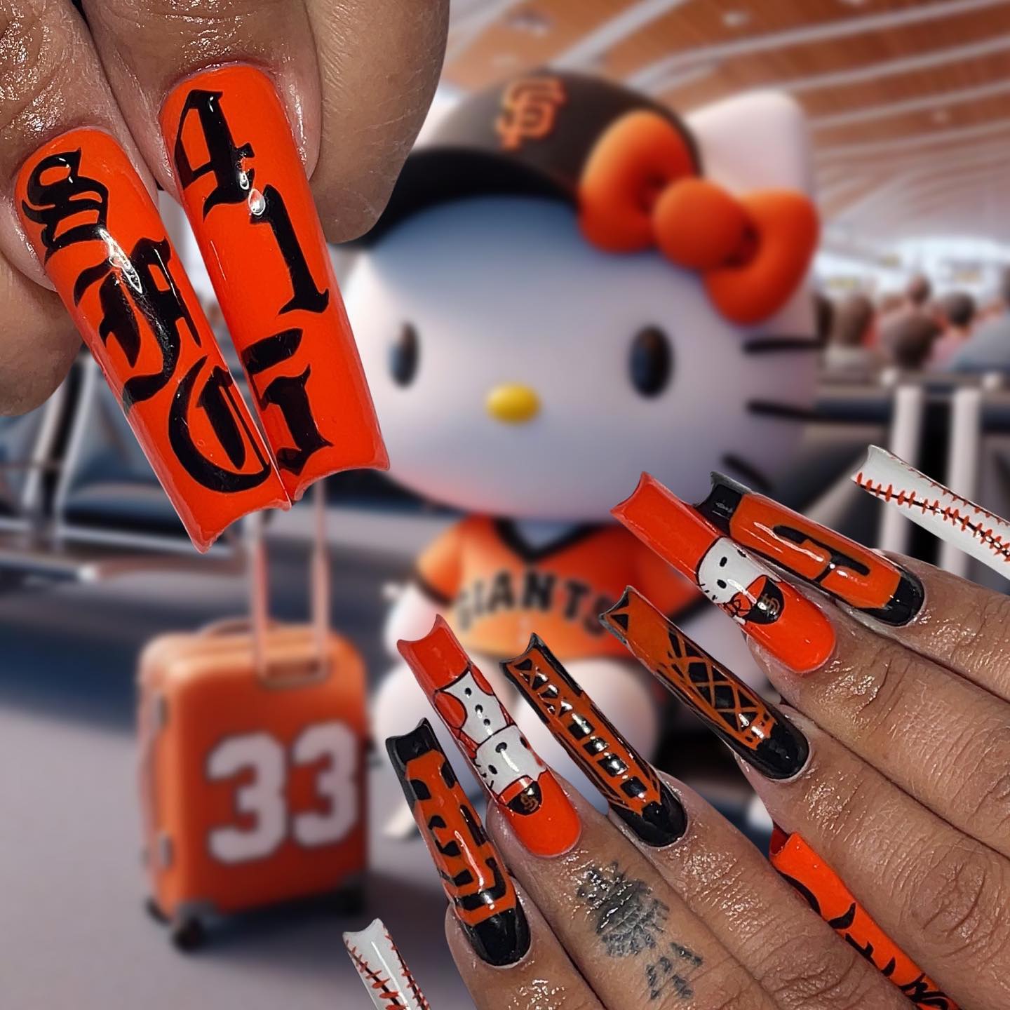 Artistic Orange and Black Nails with Giants Theme
