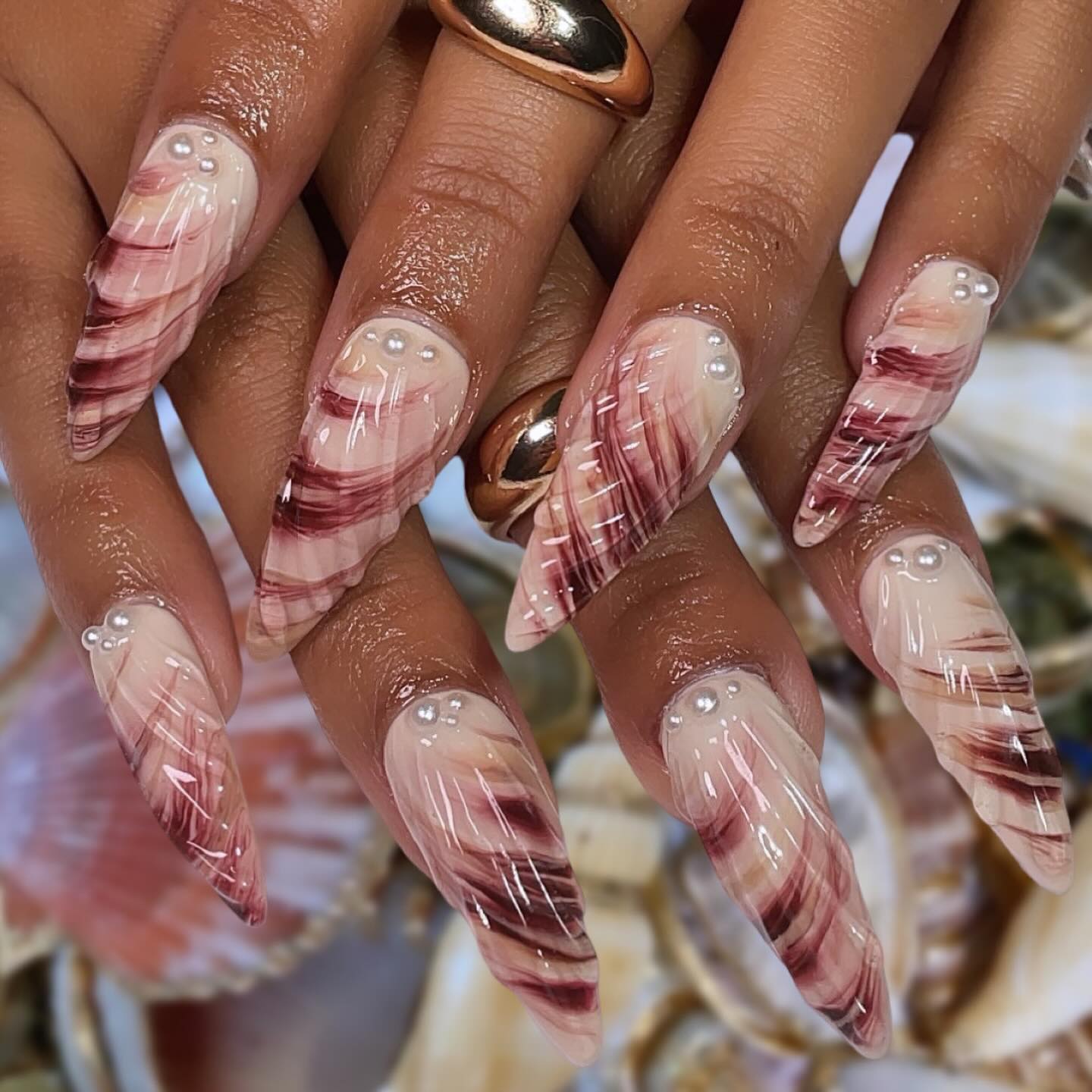 Artistic Stiletto Nails with Pearls