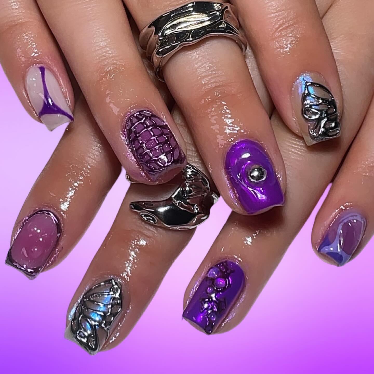 Vibrant Purple and Silver Nail Art