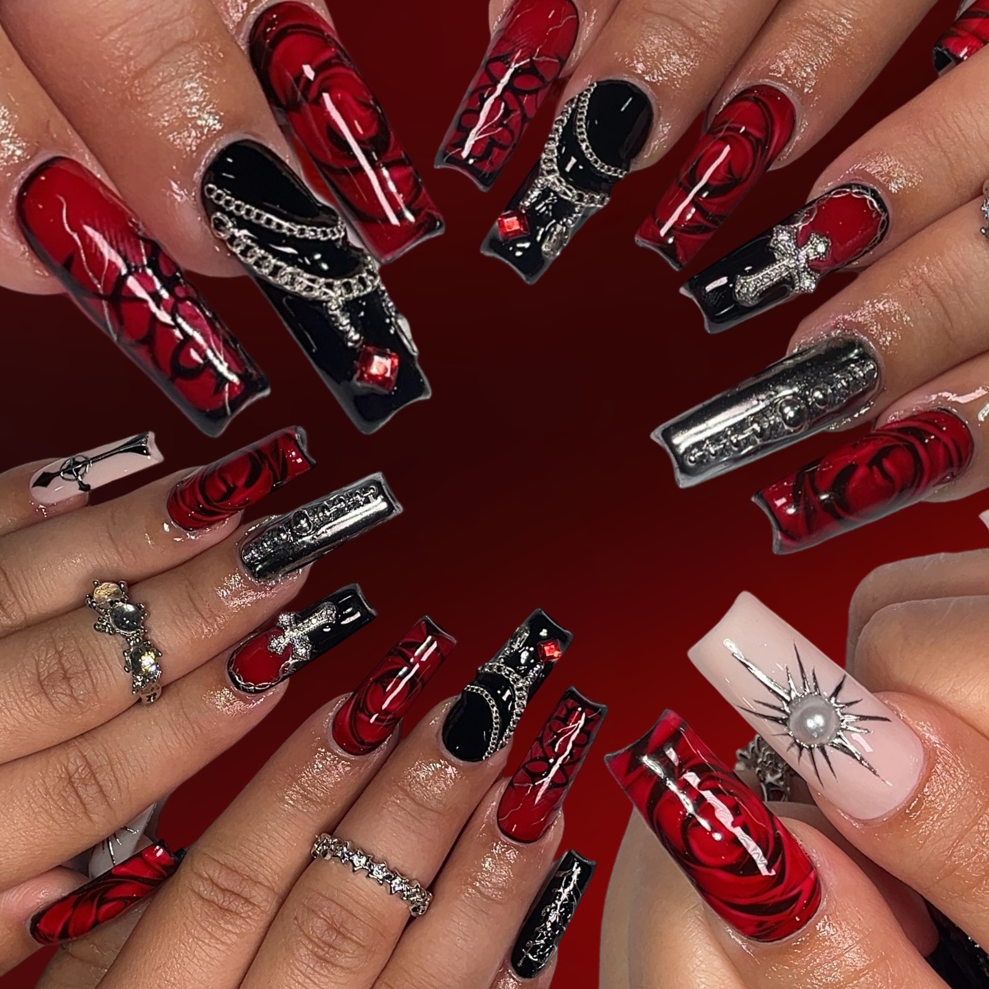 Artistic Red and Black Nail Design