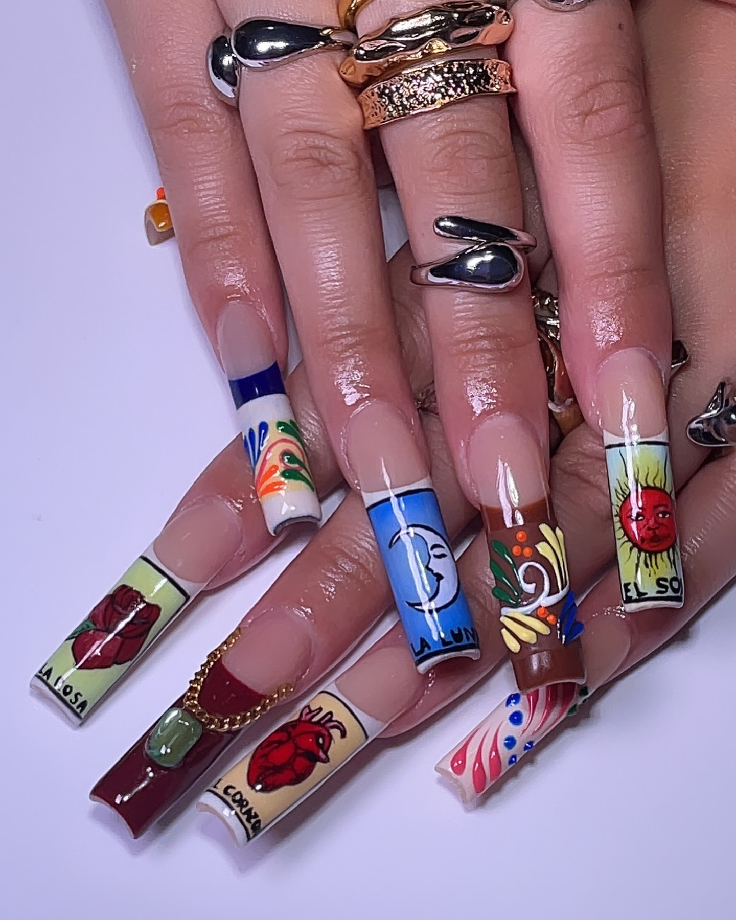 Artistic Long Nails with Cultural Designs