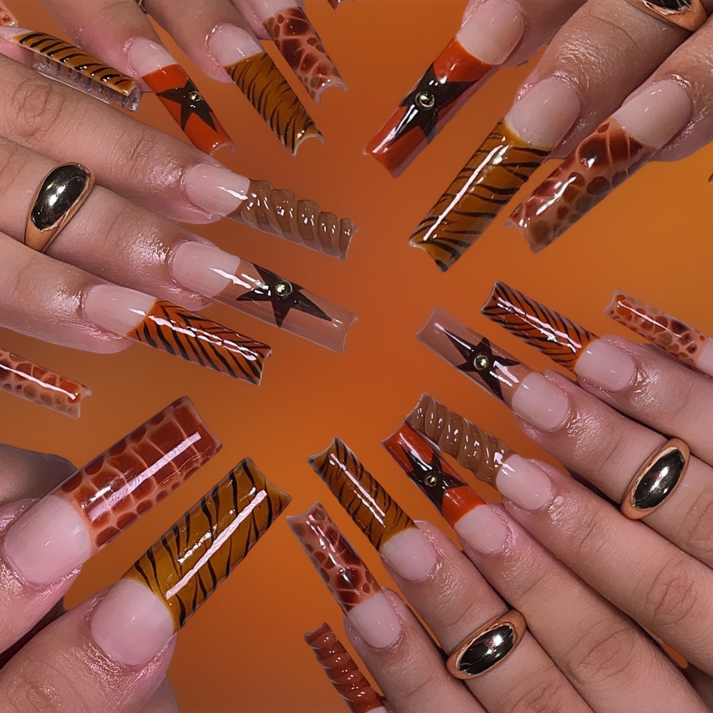 Artistic Orange and Brown Patterned Nails