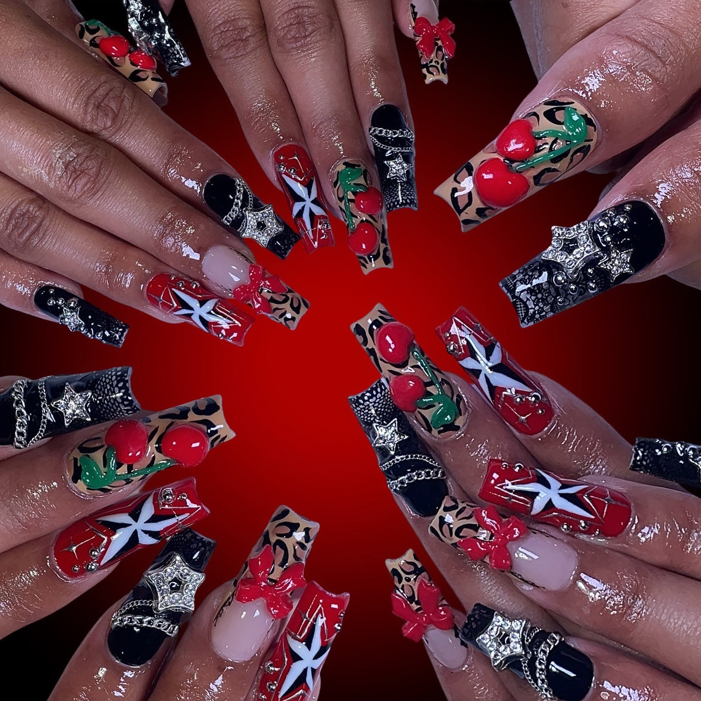 Artistic Red and Black Nail Design