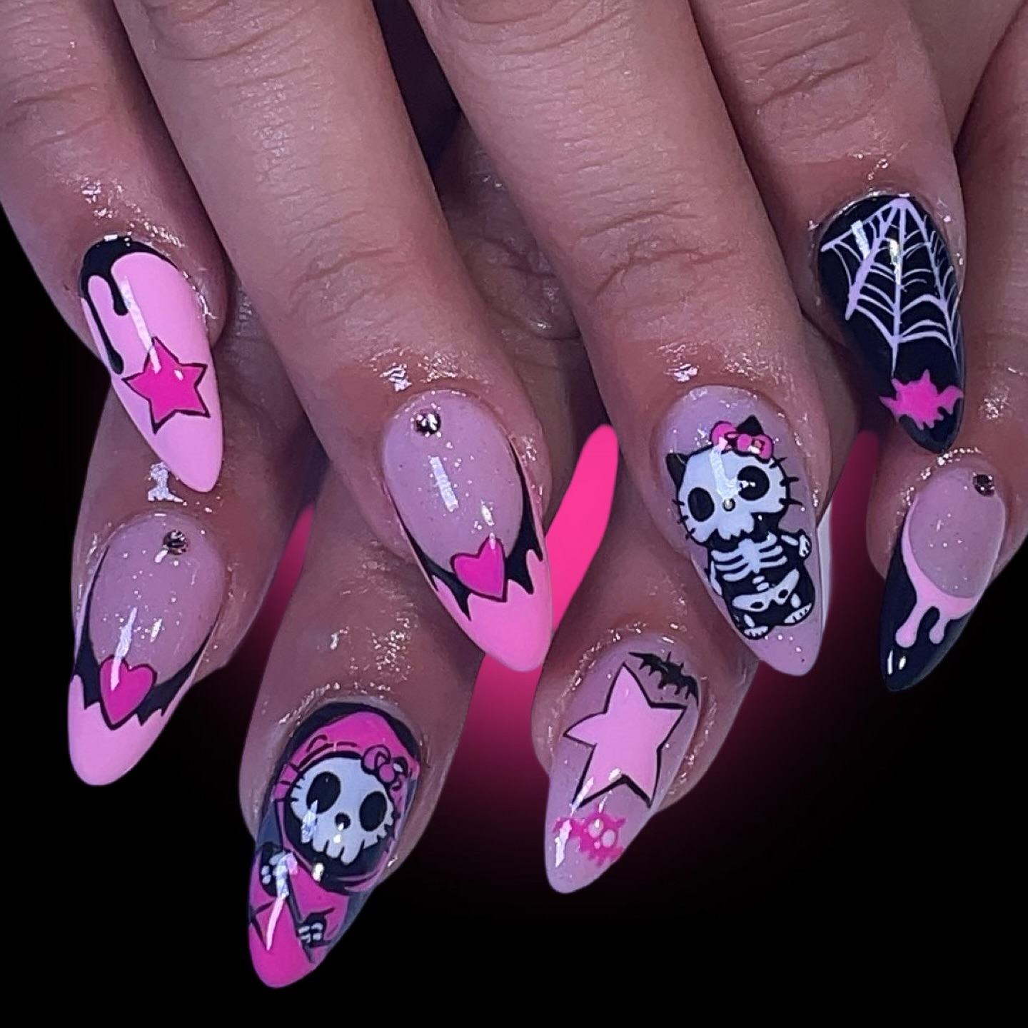 Artistic Pink and Black Skull Nails