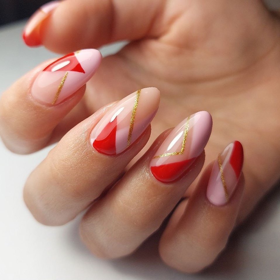 Artistic Red and Pink Nails with Gold Accents