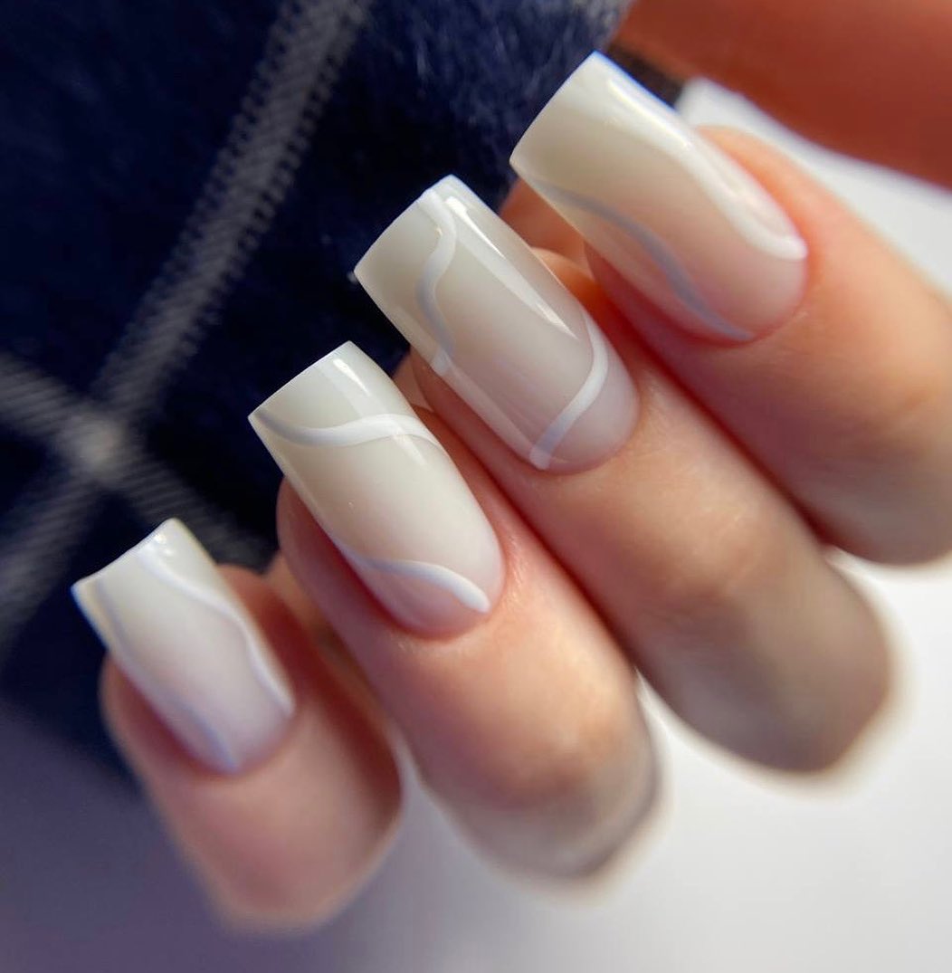 Artistic White Nails with Wavy Design