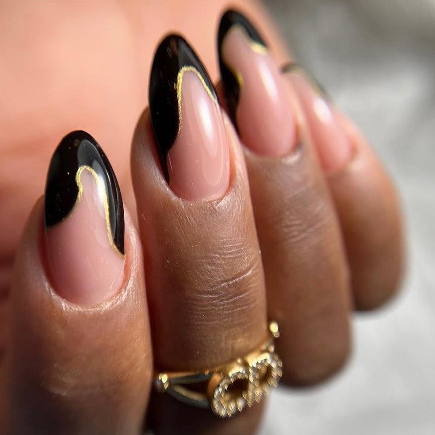 Stylish Black and Nude Nails with Gold Accent