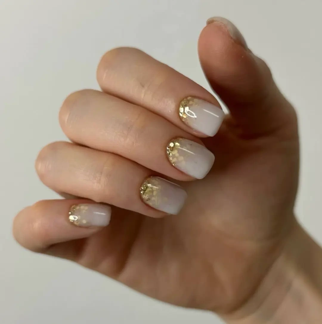 Elegant Gold-Tipped Nails