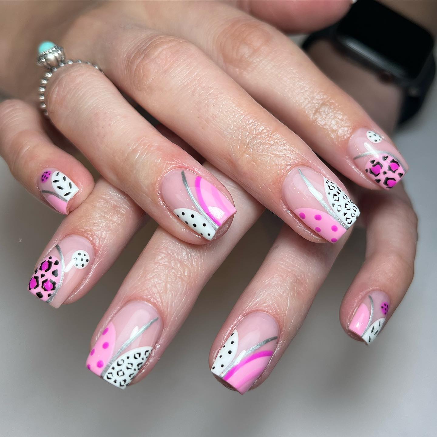 Artistic Pink and Black Patterned Nails