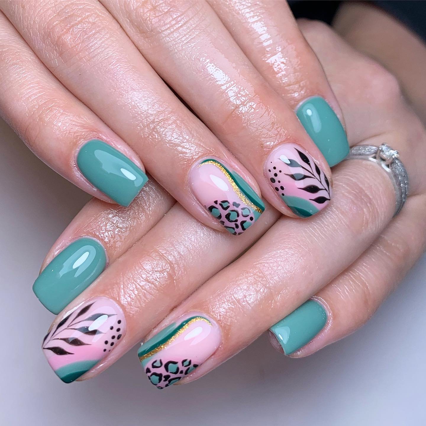 Artistic Green and Pink Nail Design
