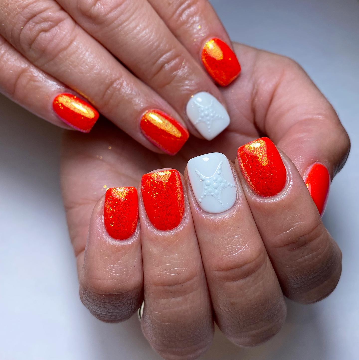 Vibrant Orange and White Nail Design
