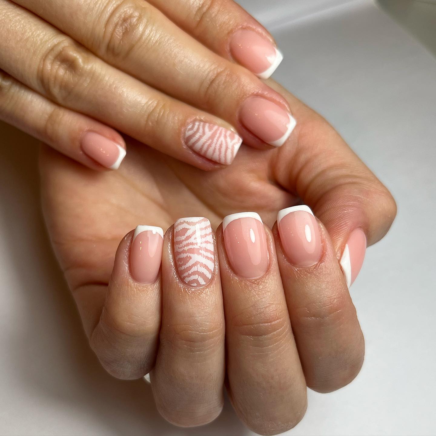 Elegant Nude Nails with Zebra Pattern