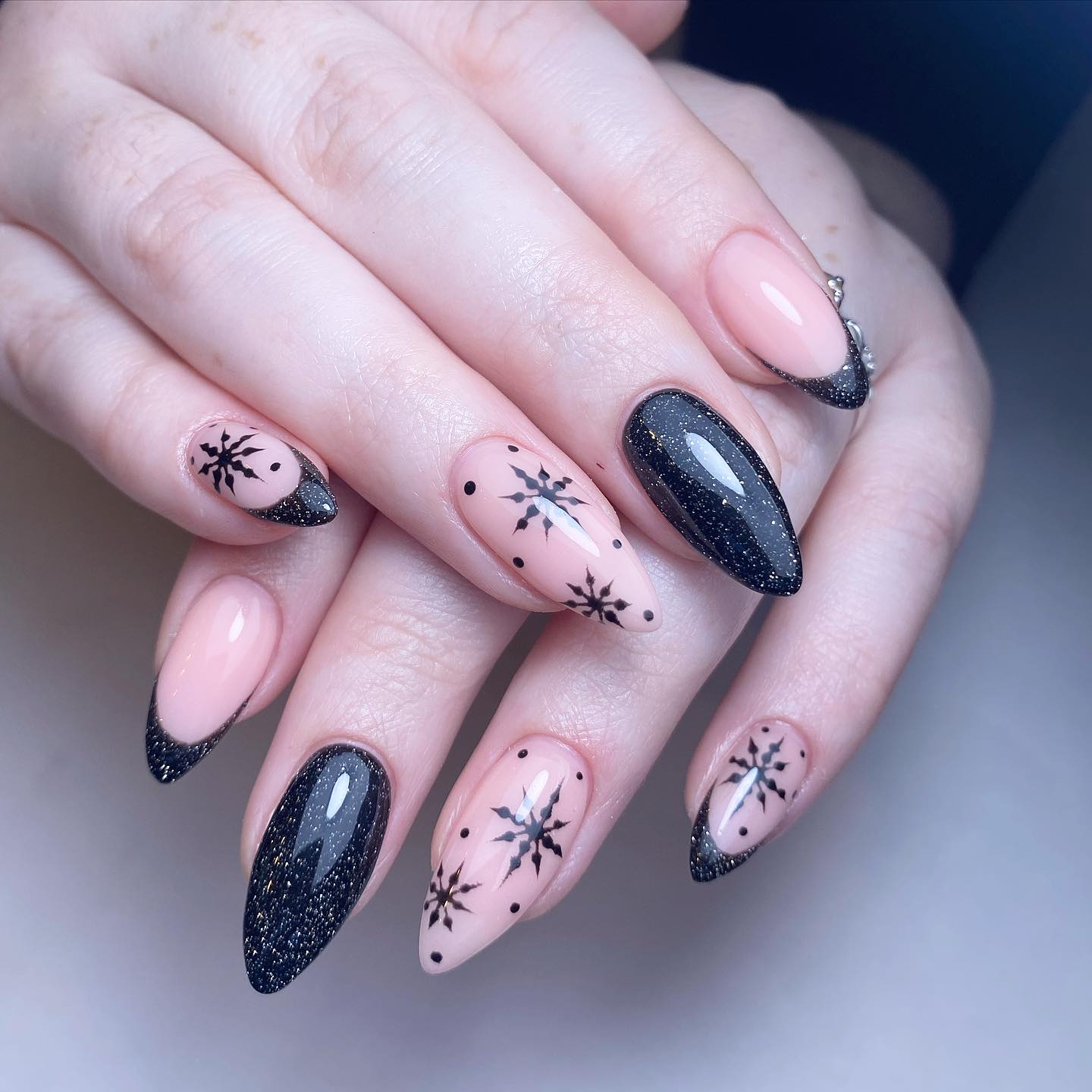 Elegant Stiletto Nails with Black and Nude Design
