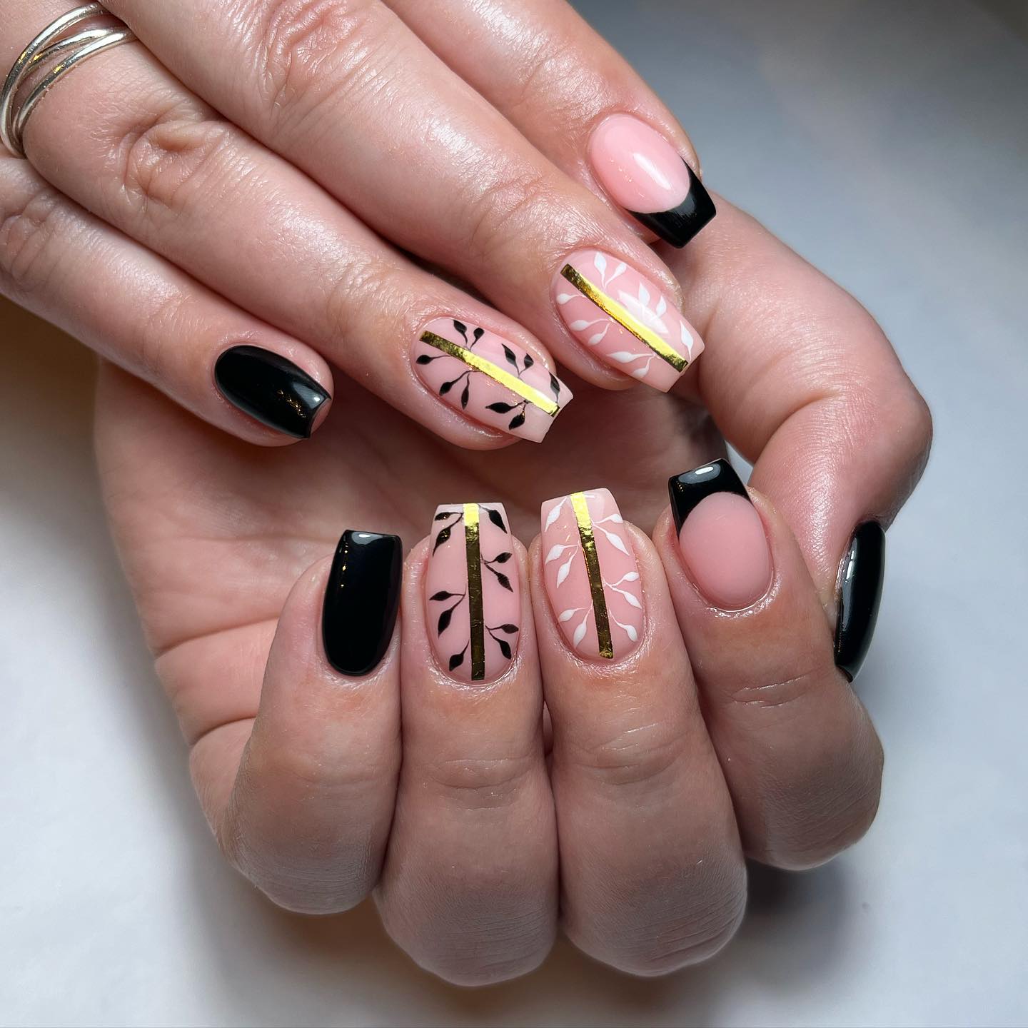 Stylish Artistic Nails with Gold Accents