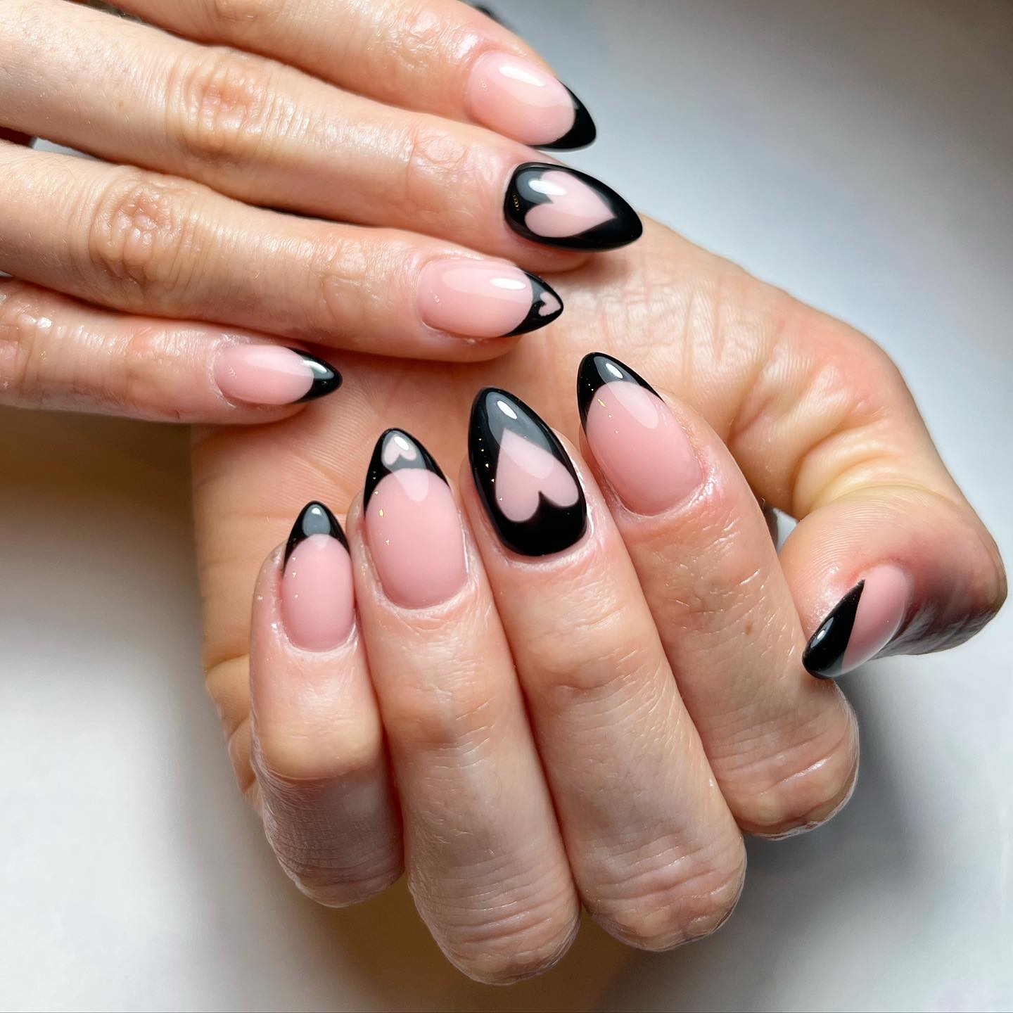 Stylish Black and Nude Heart Nail Design