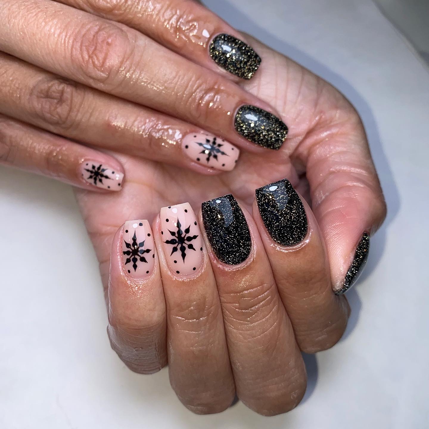 Elegant Black and Nude Snowflake Nails