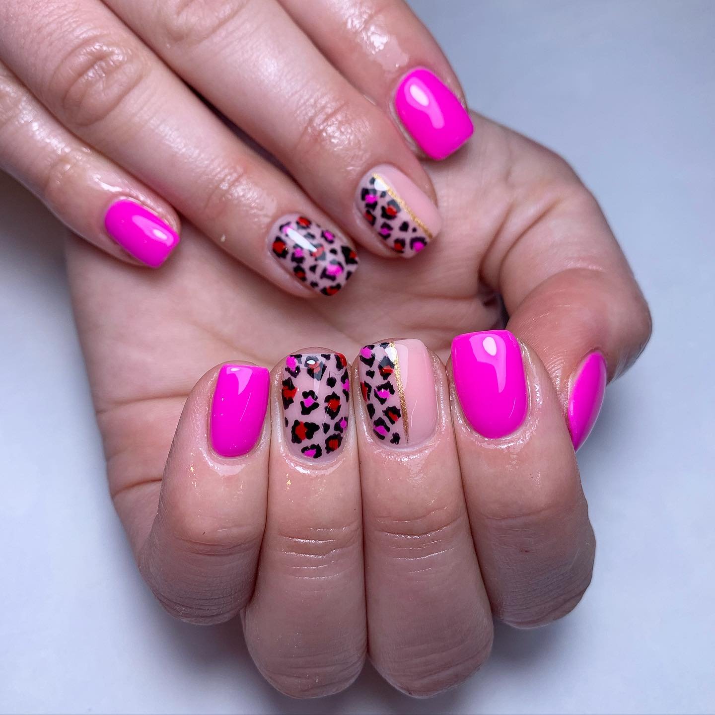 Vibrant Pink and Animal Print Nails