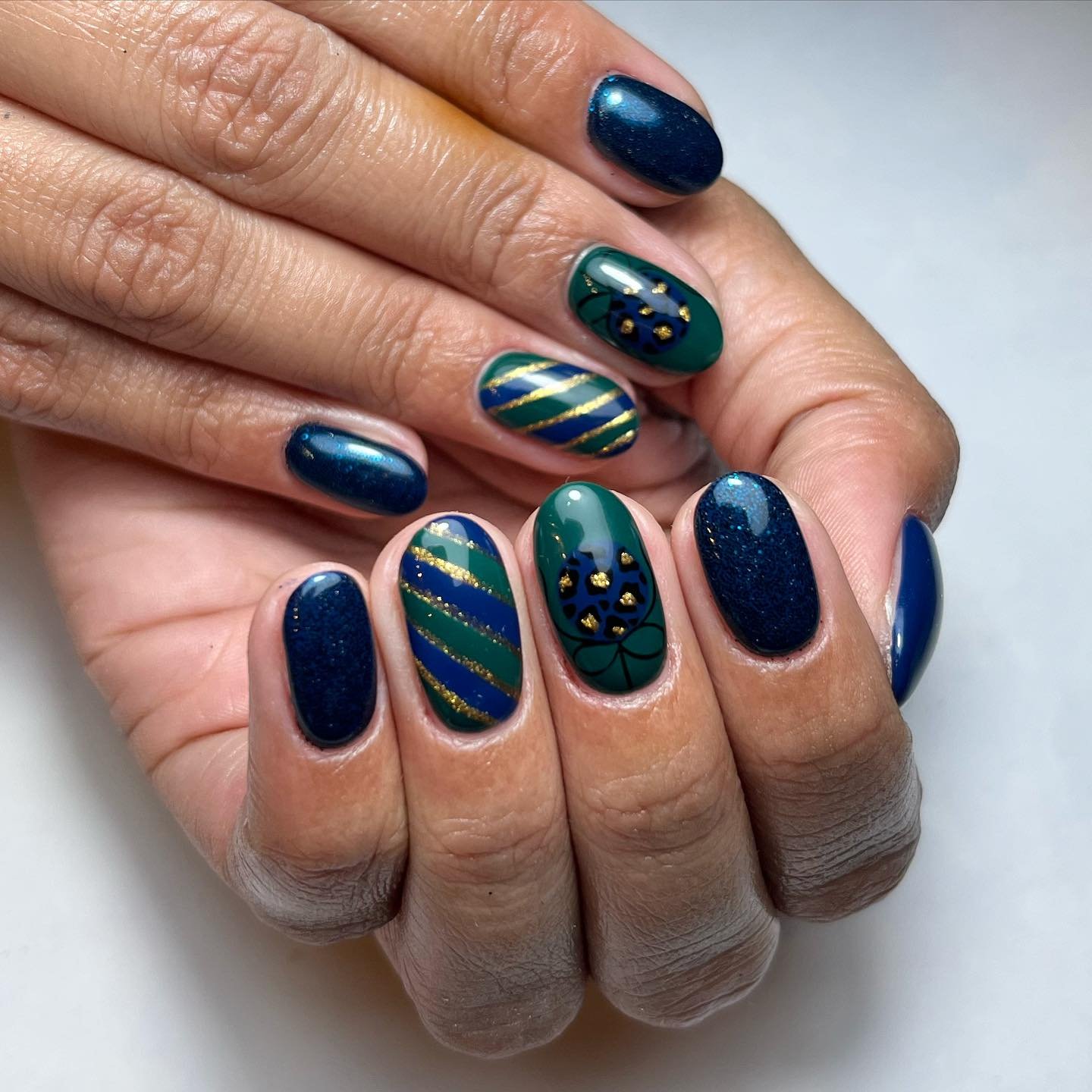 Elegant Dark Green and Blue Nail Design