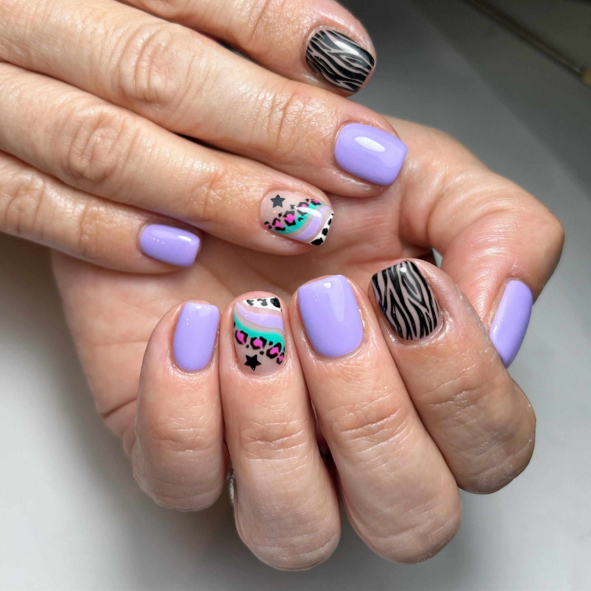 Artistic Purple and Patterned Nails