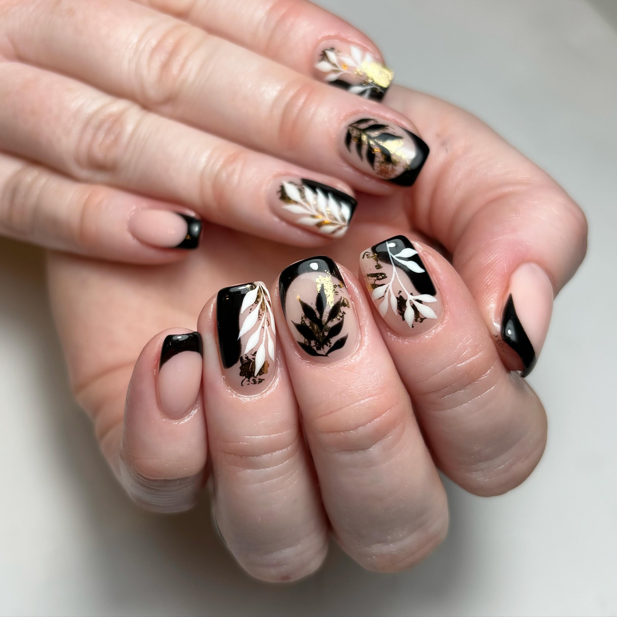 Artistic Black and Gold Leaf Nails