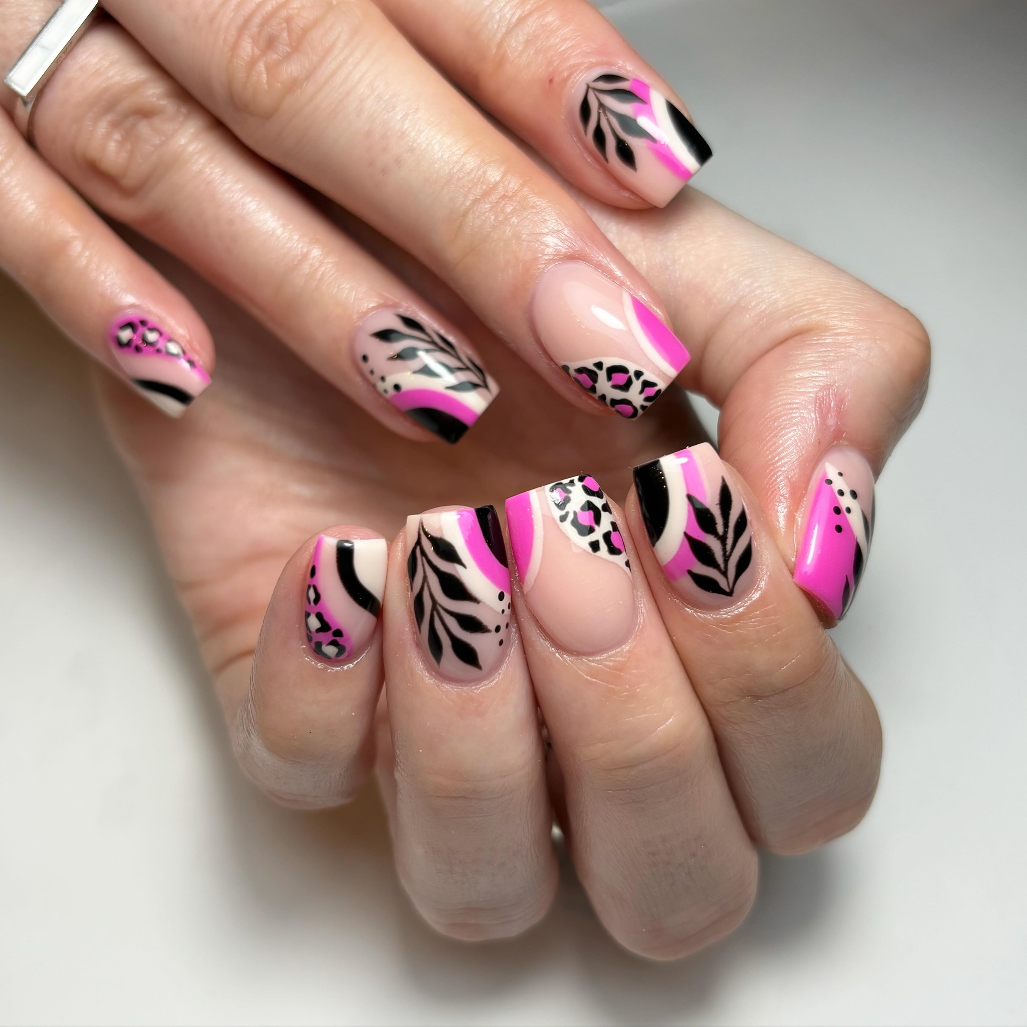 Artistic Pink and Black Nail Design