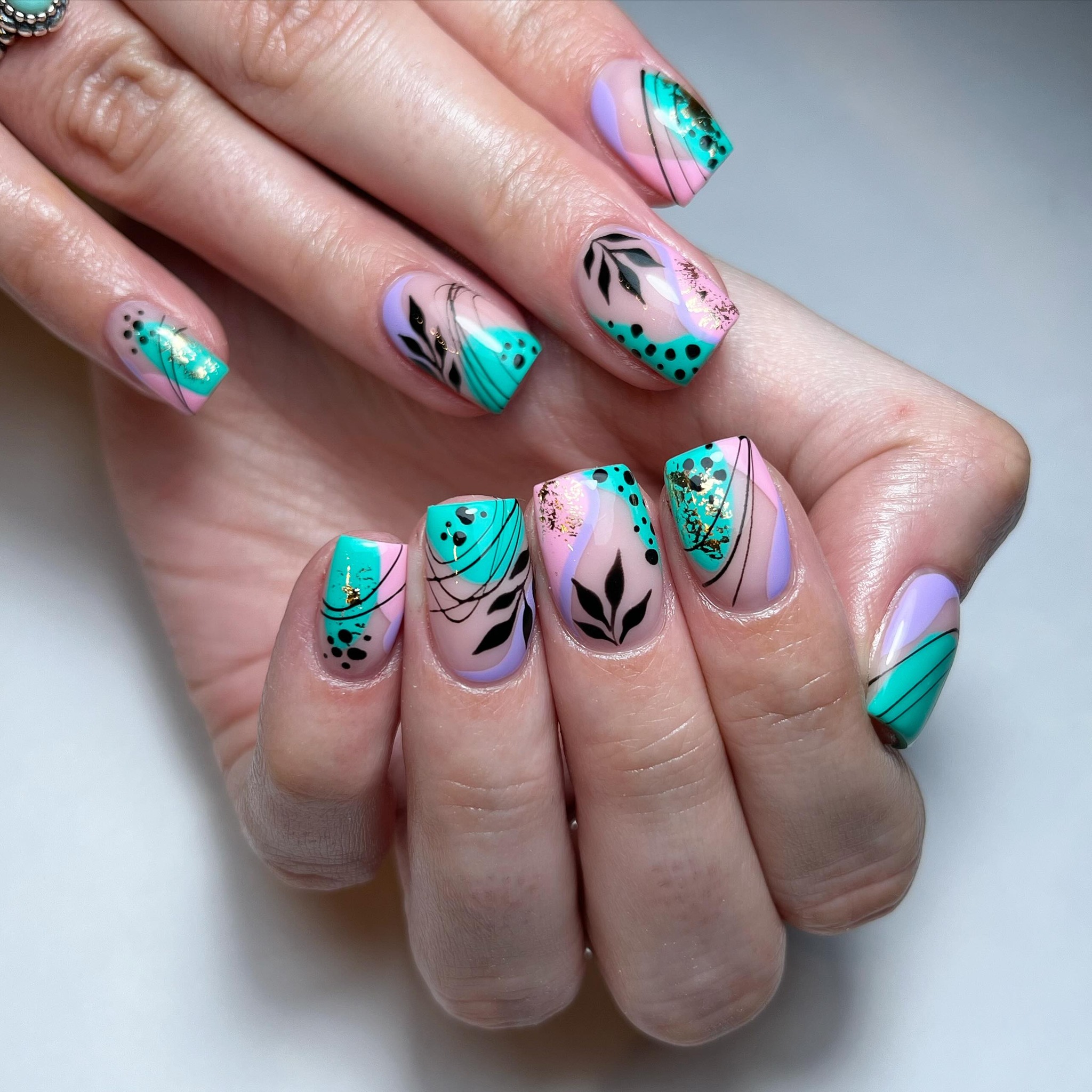 Artistic Nail Design with Floral Elements