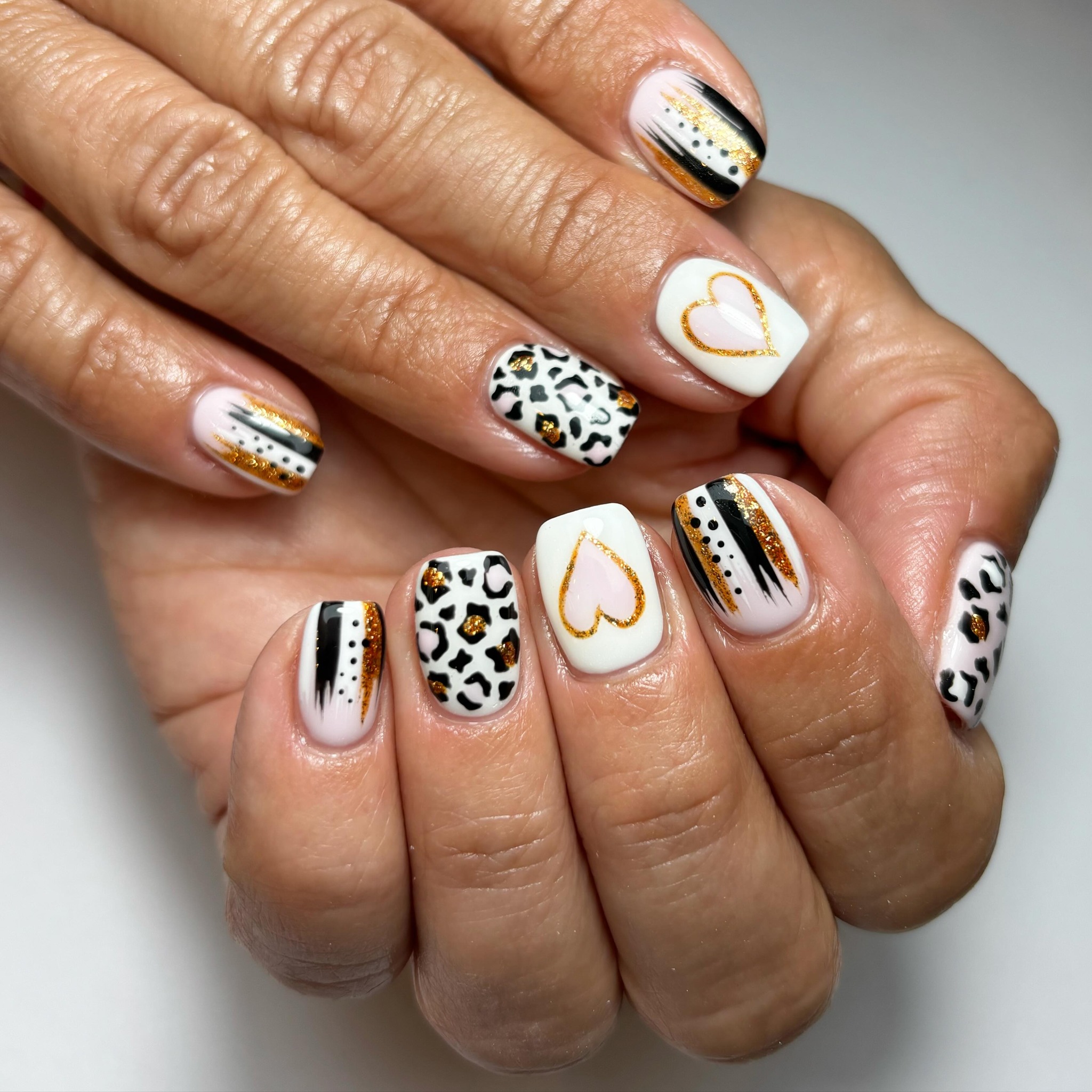Stylish Gold and Black Nail Design