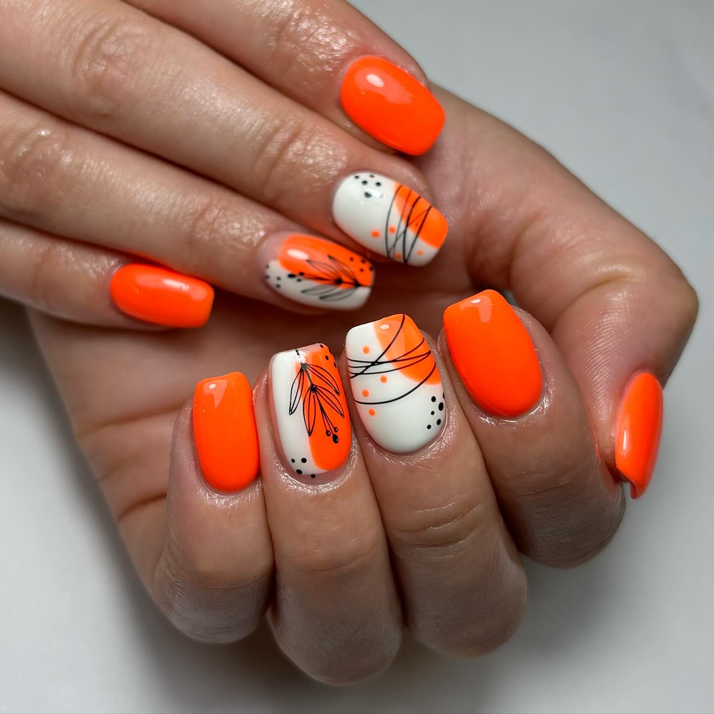 Vibrant Orange Floral Nail Art