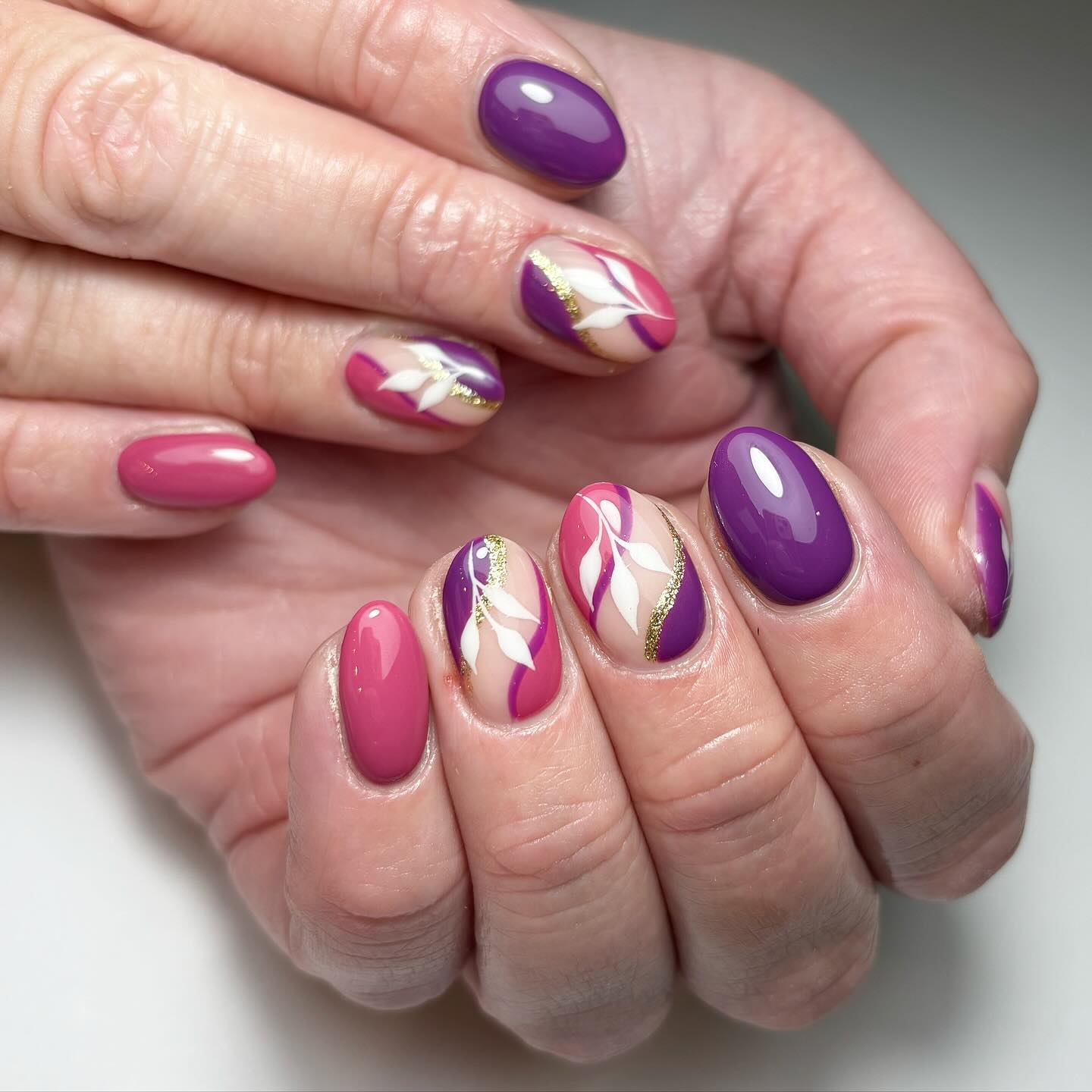 Artistic Nail Design with Purple and Pink Shades
