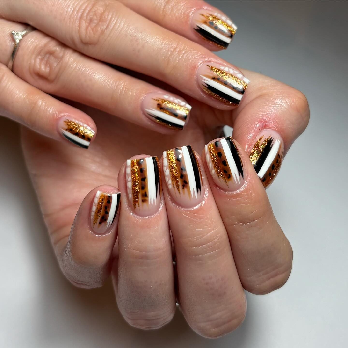 Stylish Nail Art with Glitter and Patterns