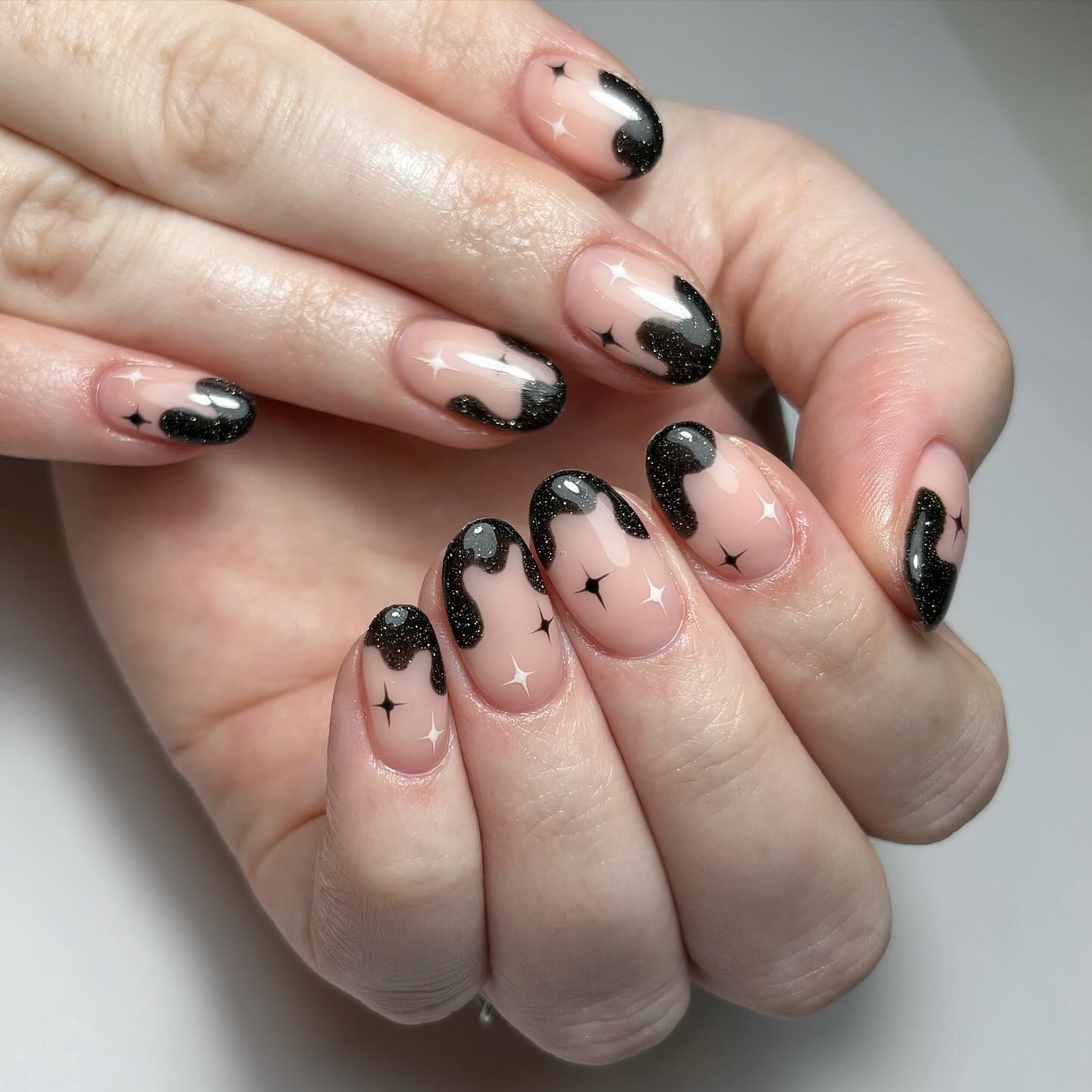 Artistic Black and Nude Dripping Nails