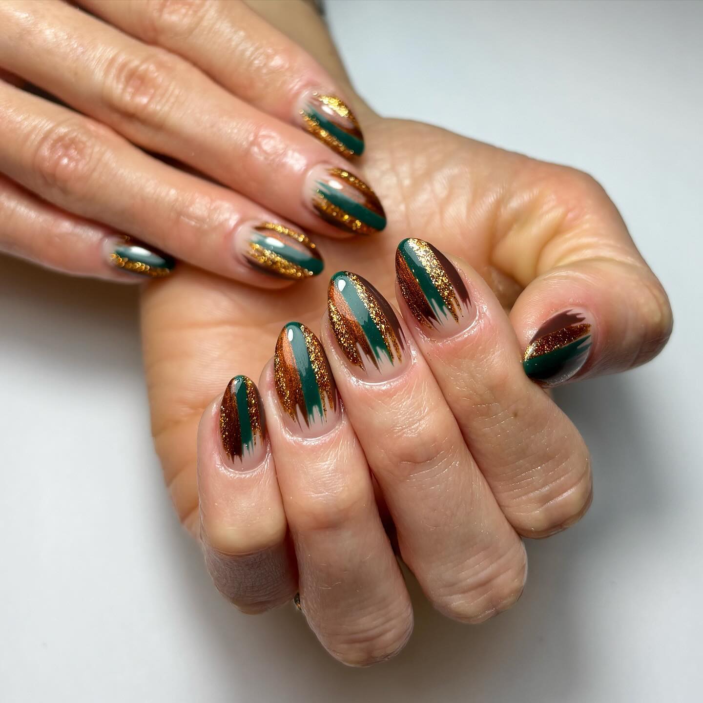 Stylish Glittery Green and Brown Nails
